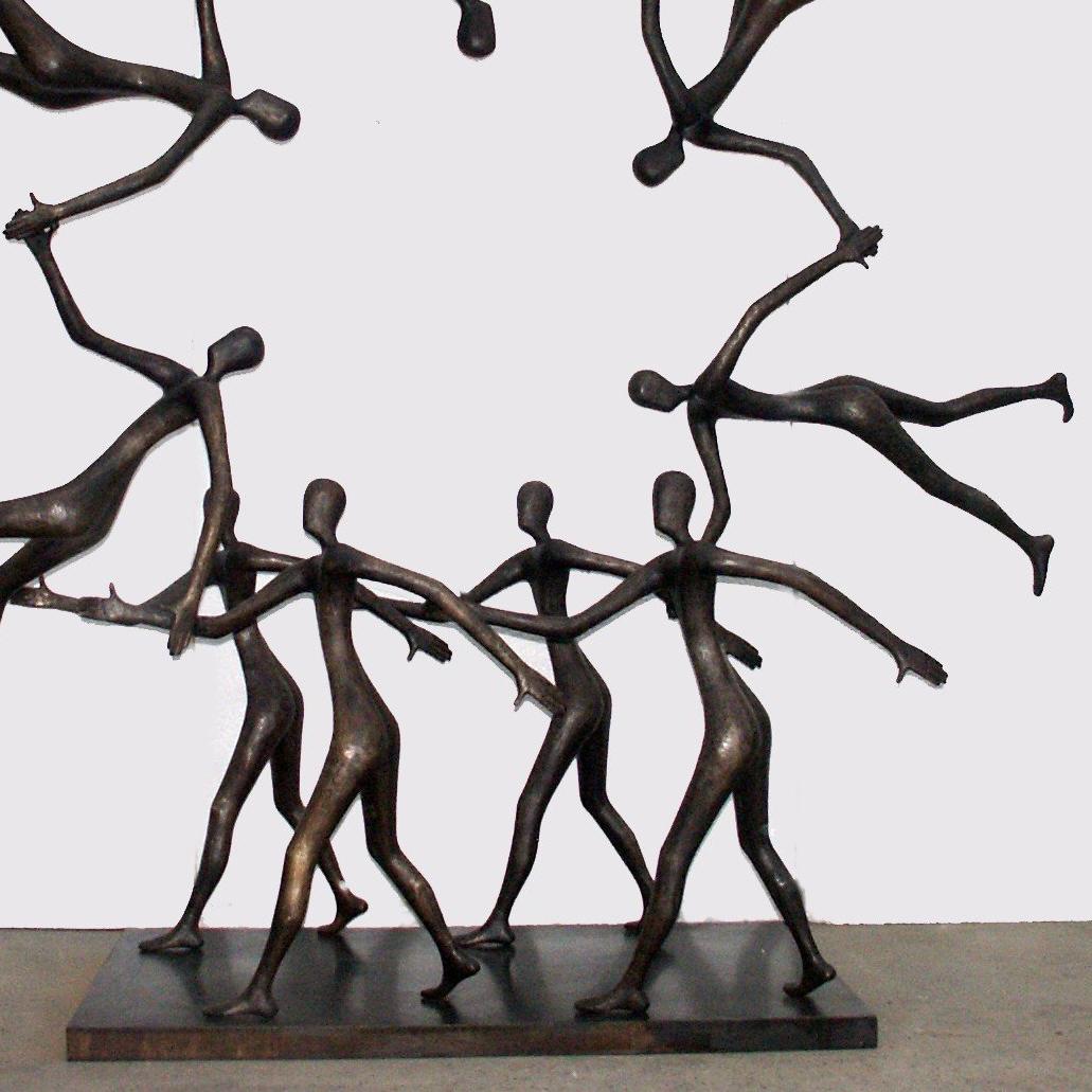 A breathtaking solid bronze sculpture by Tolla of walking characters in a circle, this bronze sculpture is sure to delight any home decor.  The characters are walking in unison with shoulders back, chest out in a very uplifting and determined