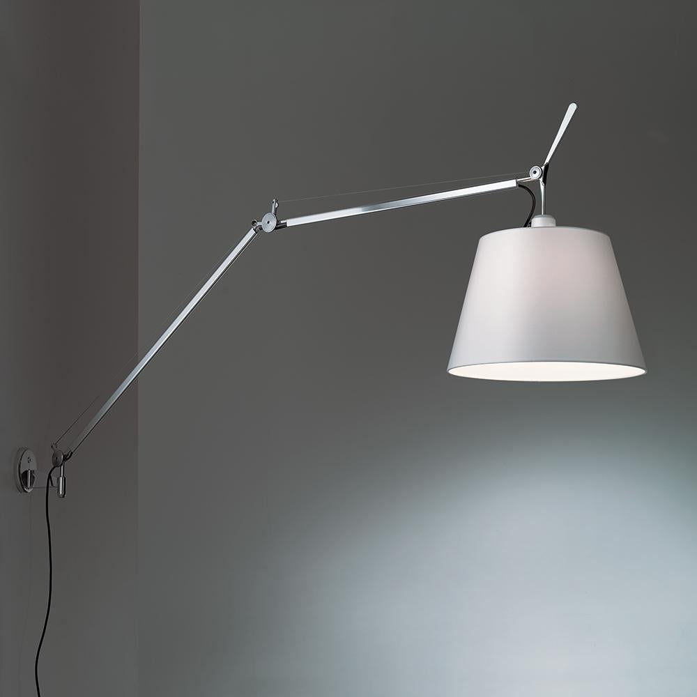 An extension to the iconic Tolomeo family, Tolomeo Mega features the same arm balancing system as the Tolomeo table lamp combined with a selection of parchment or fabric shades, creating its own Sub-family. Available in table clamp, floor, wall and