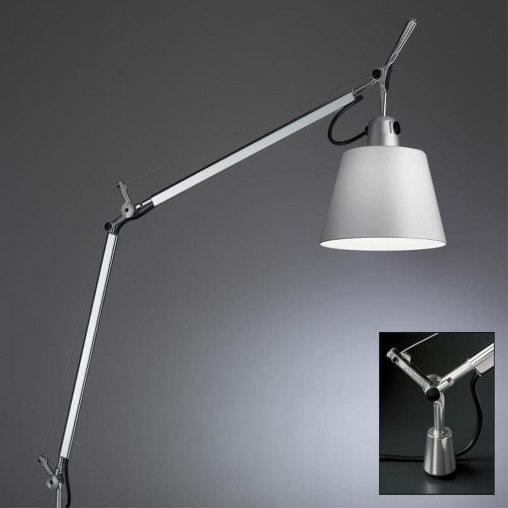 An extension to the iconic Tolomeo family, Tolomeo with shade features the same arm balancing body system as the Tolomeo table lamp combined with a selection of parchment or fabric shades, giving a warmer and more transitional look to the original