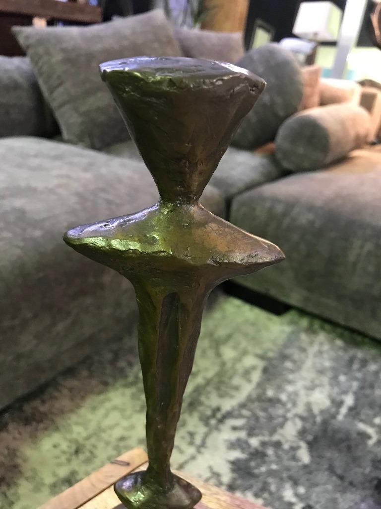 Bold. Heavy. Striking. This candlestick (model CS10-1) was made by renowned American sculptor Tom Corbin. 

Signed by Corbin in the base.

The Totem works are very sought after and becoming hard to find.

Would clearly stand out in any