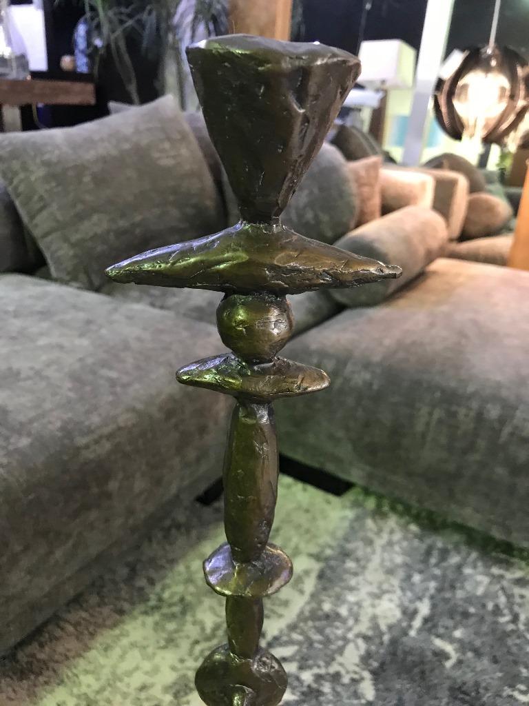 Bold. Heavy. Striking. This candlestick (model CS18-1) was made by renowned American sculptor Tom Corbin. 

Signed by Corbin in the base.

The TOTEM works are very sought after and becoming hard to find.

Would clearly stand out in any