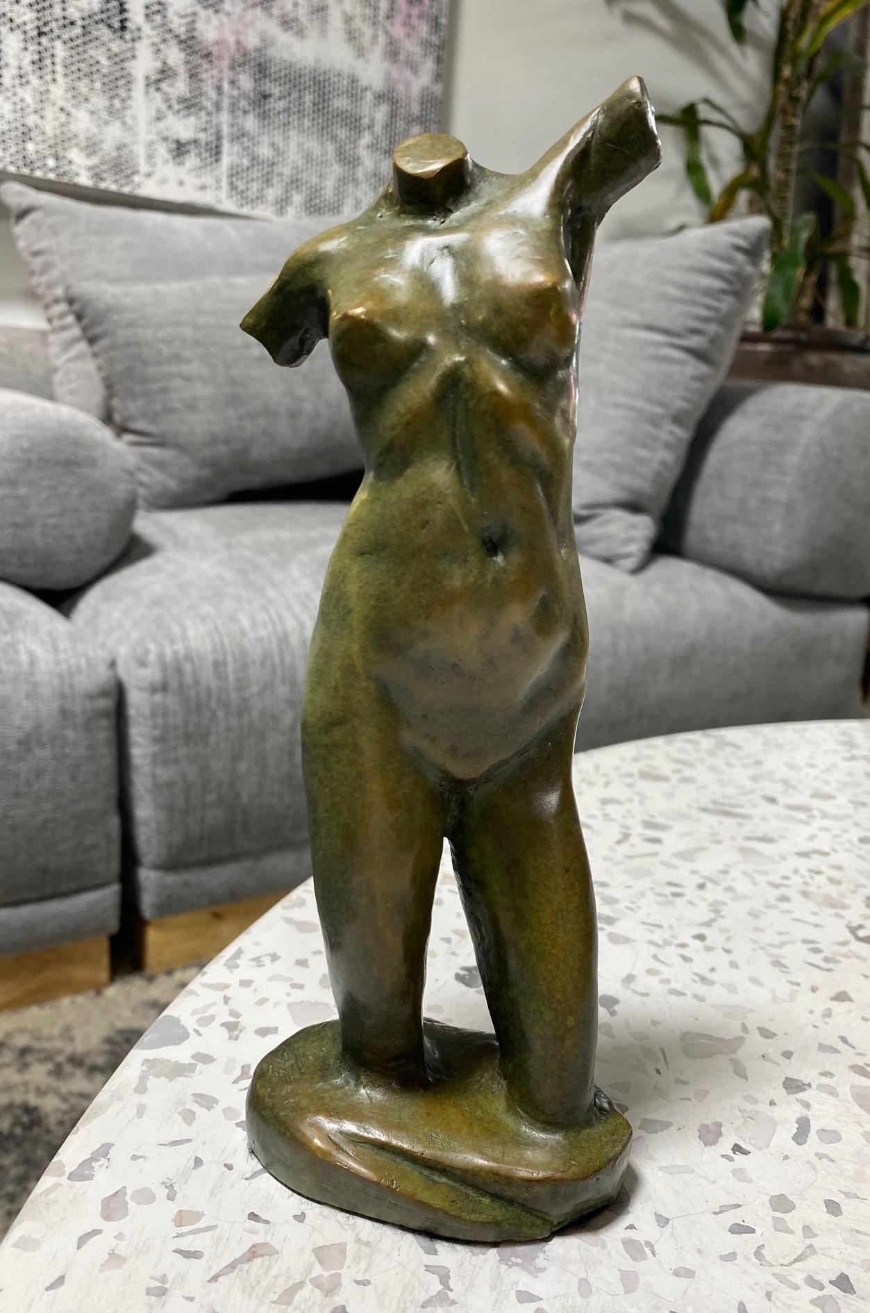 A wonderful work by renowned American artist/ sculptor Tom Corbin. This piece of a figurative nude female/woman is titled Reaching Torso and features a fantastic rich green/brown patina. 

The limited edition work is signed, dated (2001), and