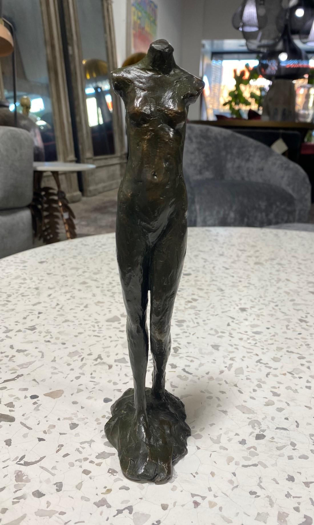 A beautiful work by renowned American artist/ sculptor Tom Corbin. This piece of a walking figurative nude female/woman features a fantastic rich and dark patina and has a wonderful feel to it. 

The limited edition work is signed, dated (1994),