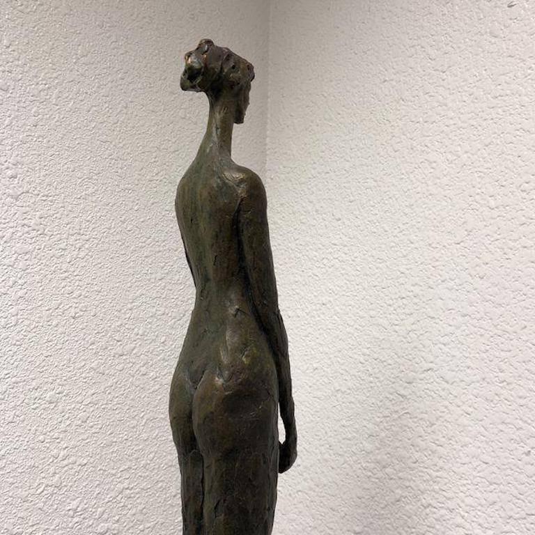 A handcrafted sculpture by Tom Corbin. The female structure is 