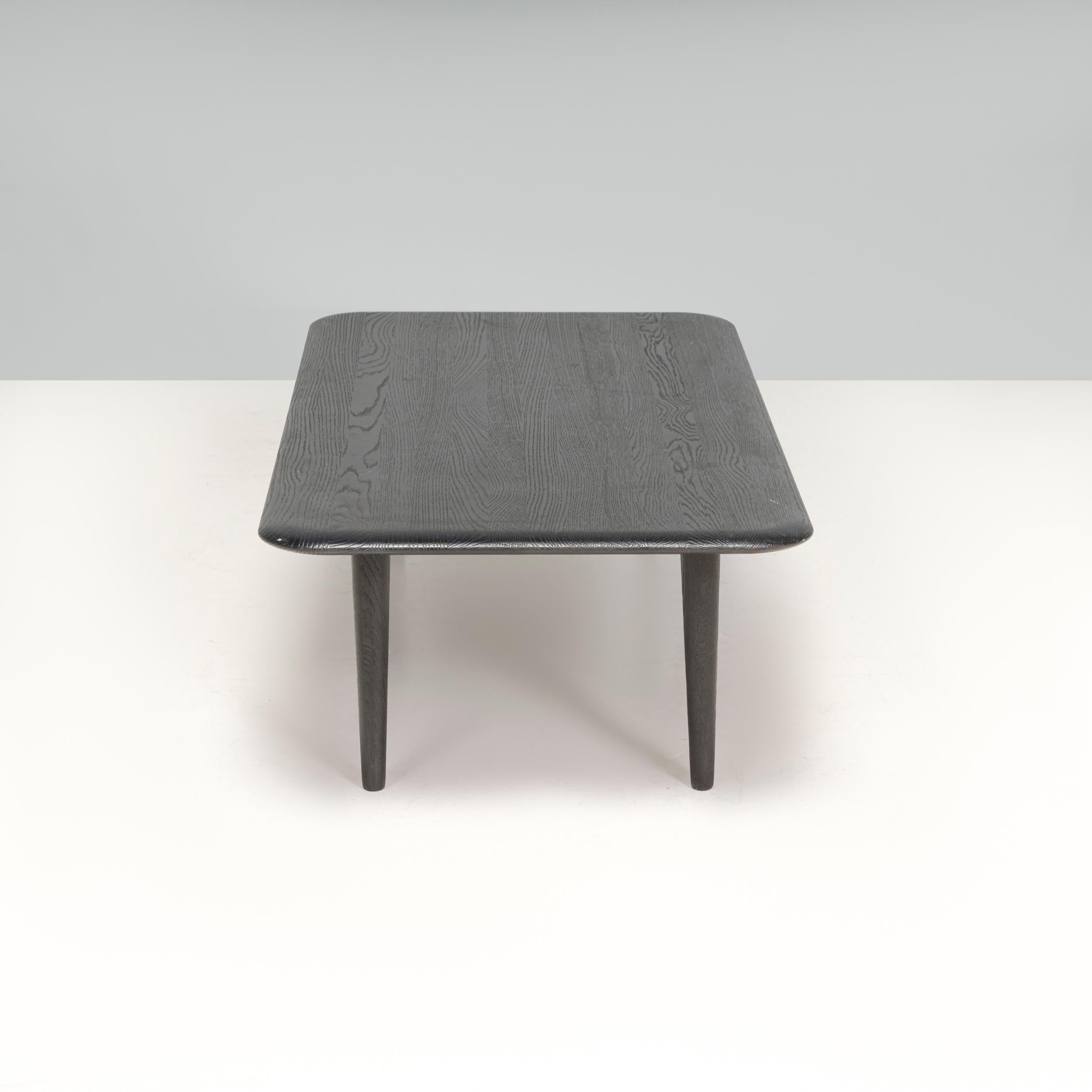 Designed by Tom Dixon, one of the best known British designers of the 21st century, this low dark oak slab table combines quality materials with a sleek aesthetic.

 Constructed from solid crowned oak, the wood has been deeply brushed and lacquered