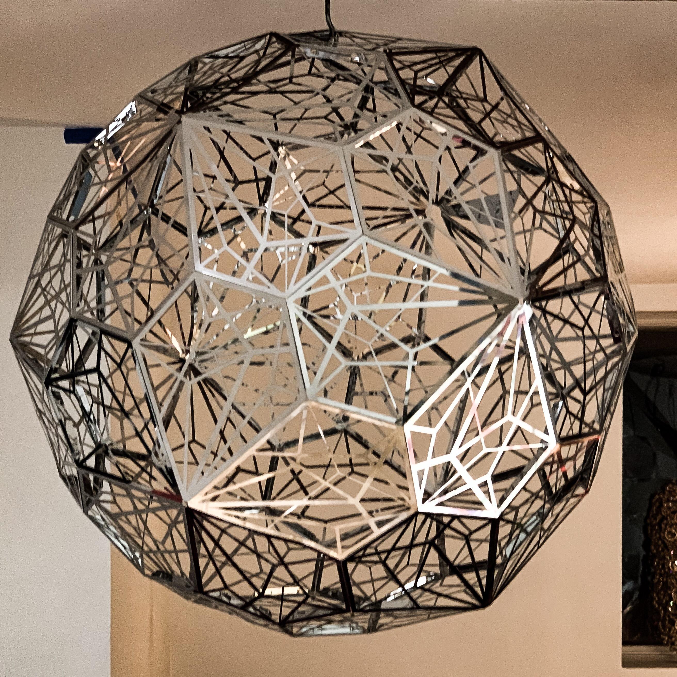 The Etch Web Pendant Light is a vast shade with an unusual open structure, designed to cast atmospheric angular shadows when lit. Another experiment in Tom Dixon's long-running exploration of mathematics and geometry, an irregular pentagon shape is