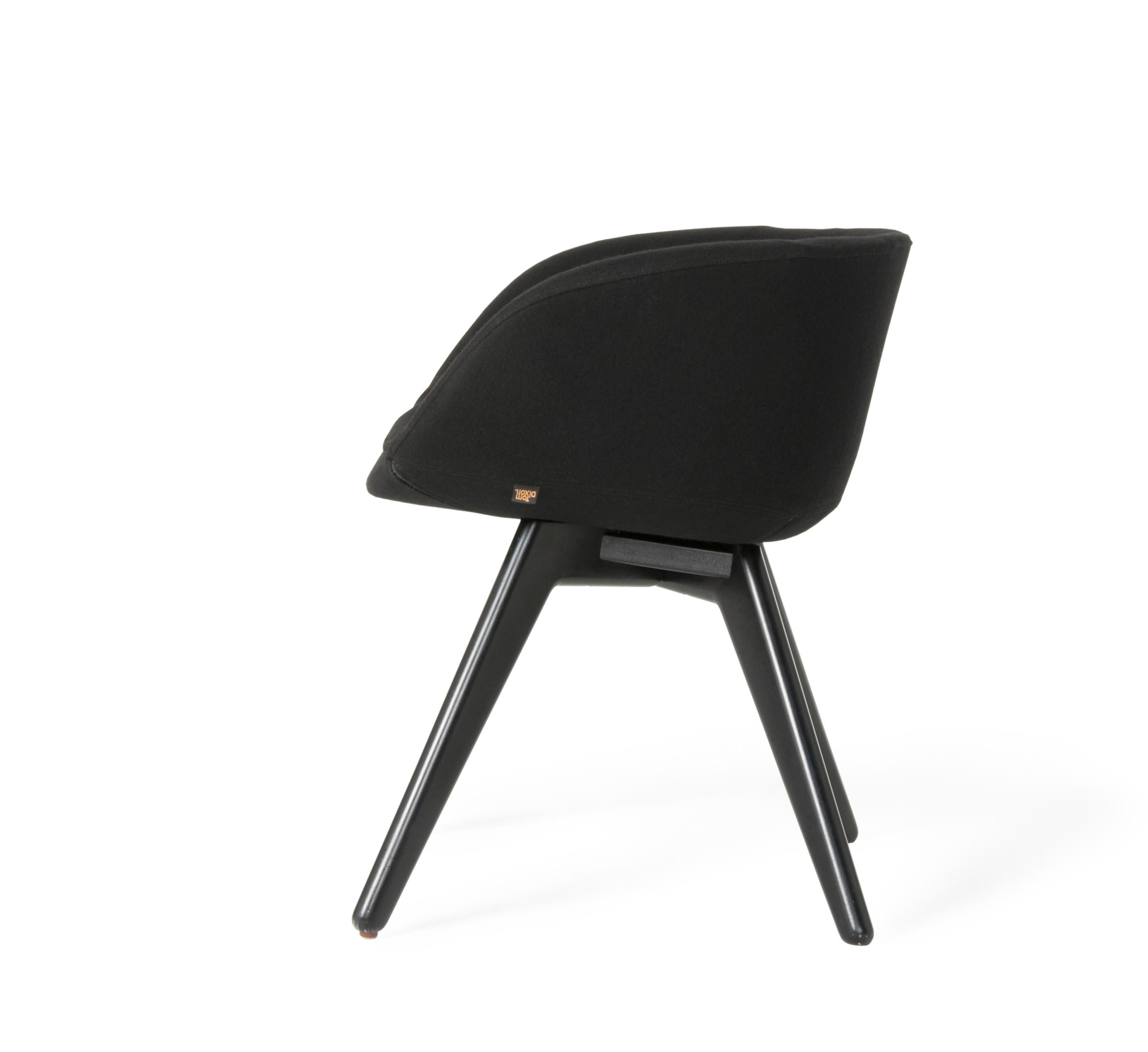 Tom Dixon scoop low chair upholstered in black tonus fabric with black oak leg.
Developed for a Design Research Studio project for the Royal Academy of Art Restaurant in London, the brief was for a chair that was generously proportioned, comfortable