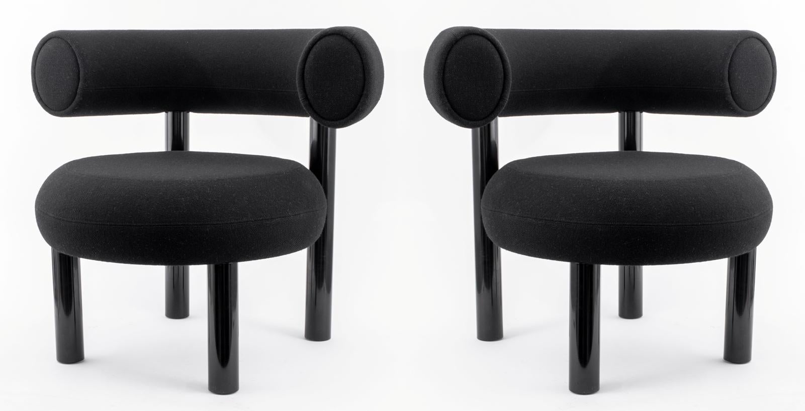 Pair of Tom Dixon (British, b. 1959) Fat lounge chairs, of molded foam upholstered in black wool upon four black lacquered metal legs, 
