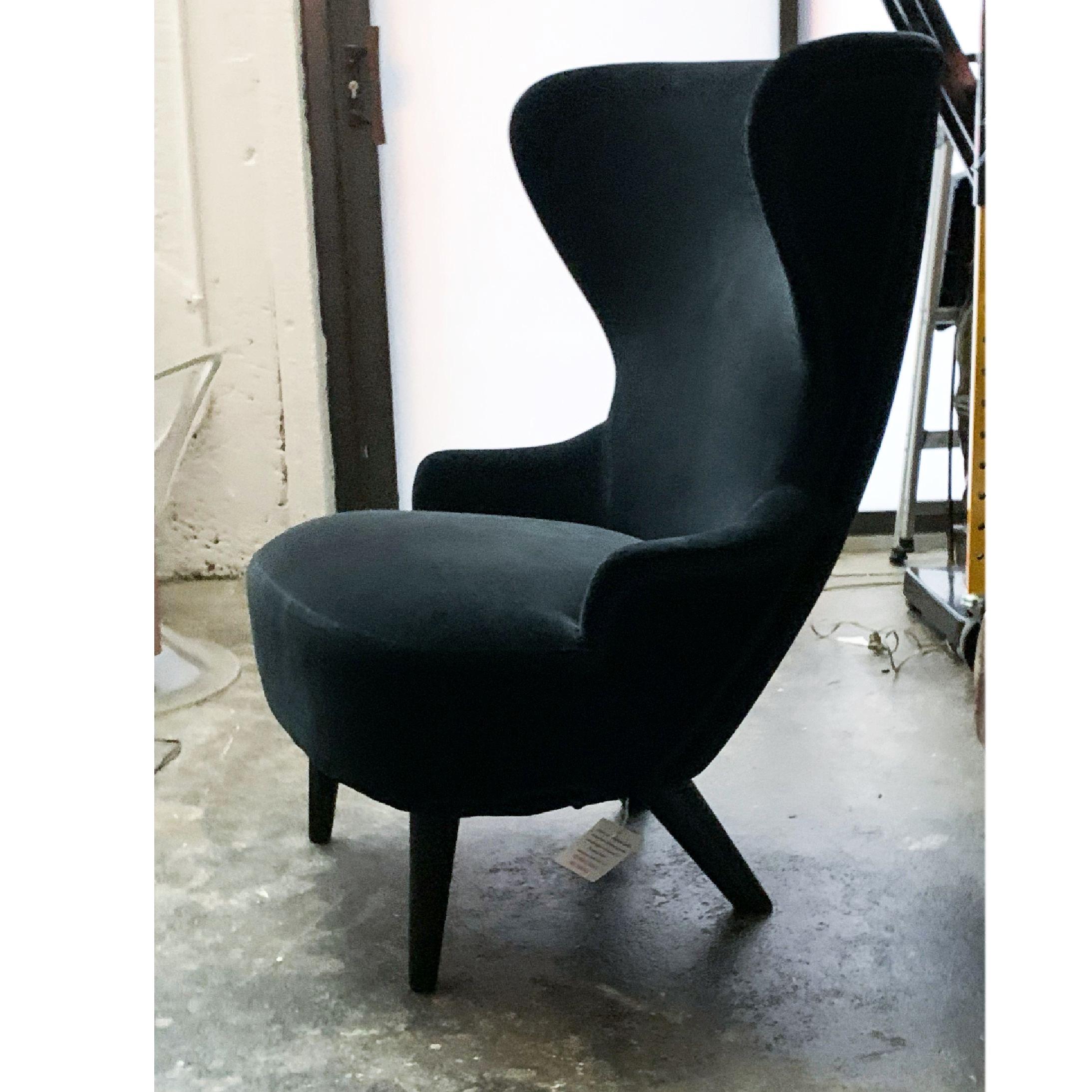 Tom Dixon wingback armchair lounge, George Smith, UK, black velvet.

Wingback was inspired by traditional 17th century Wingback and balloon-back archetypes, and was developed for Shoreditch House Members Club. Its expressive sweeping curves allows