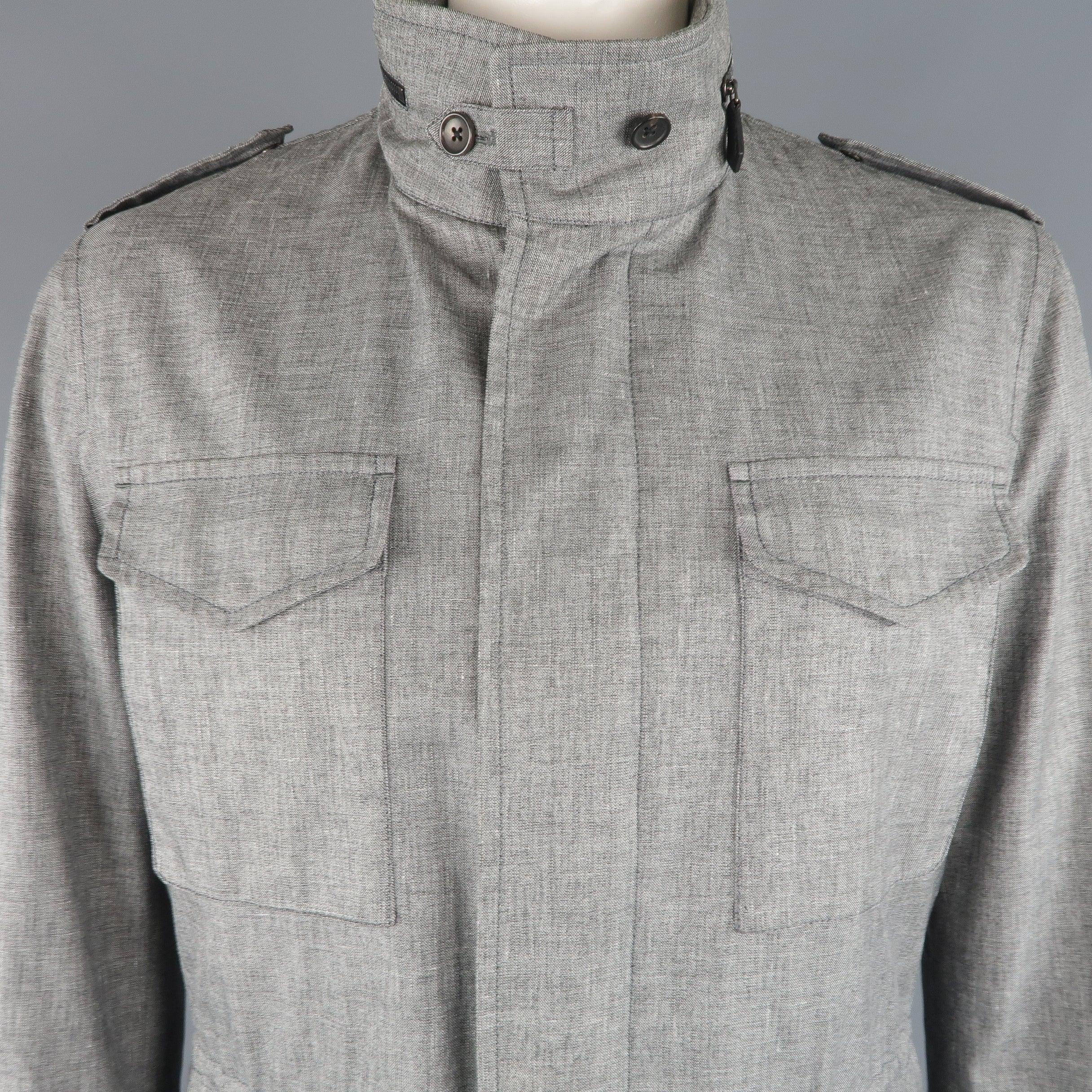 TOM FORD parka comes in linen blend light heather gray fabric with a high collar, epaulets, hidden placket zip closure, drawstring waist, zip out hood, and patch flap pockets. Minor wear. Made in Italy.
 Good Pre-Owned Condition.
  
 

 Marked:  IT