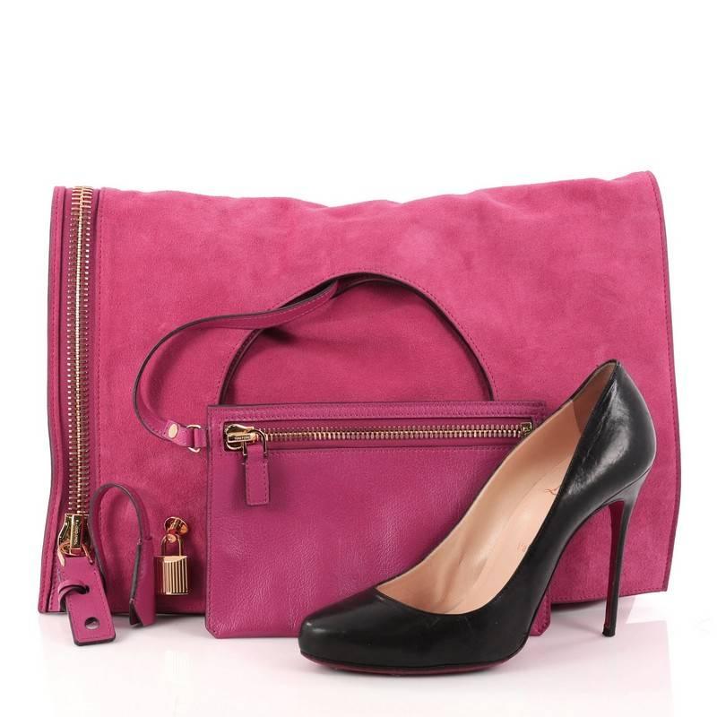 This authentic Tom Ford Alix Fold Over Bag Suede Large showcases a minimalist, clean and functional accessory perfect for the modern woman. Constructed in pink suede, this fold-over tote features a cutout top handle, exterior side zip, padlock on