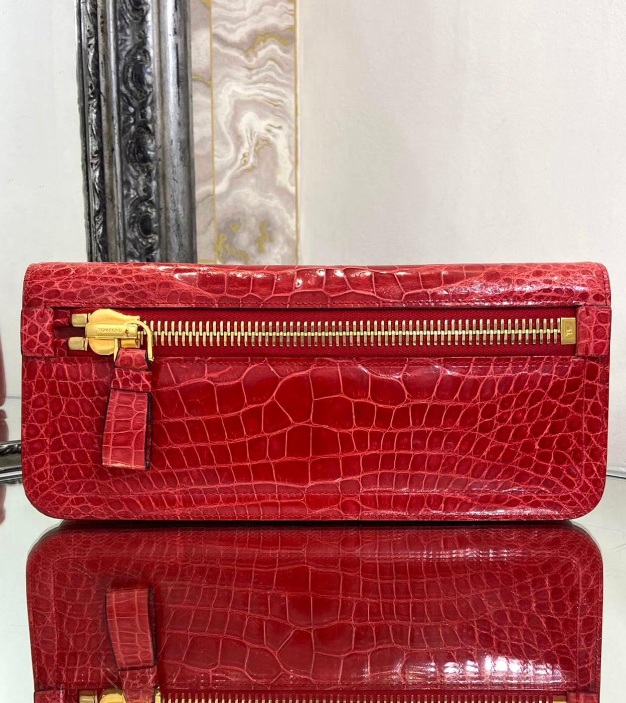 Tom Ford Alligator Skin Clutch Bag

Iconic oversized zip to the front. Gold hardware with snap closure and lined with red suede. One zip pocket to the inside.

Additional information:
Size – 30.5 W x 4 D x 14 H cm
Composition- Alligator Skin