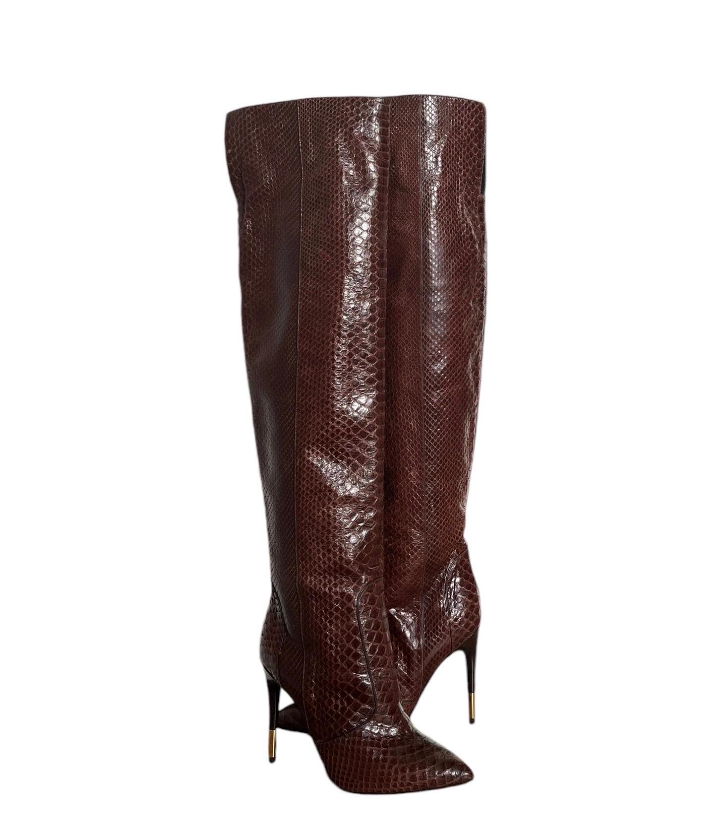 TOM FORD ANACONDA OVER THE KNEE BOOTS 
Looking to make a fierce fashion statement this season? Nothing says it more than the anaconda that forms this Tom Ford stiletto boot. Genuine anaconda (Argentina). Pointed toe. 4 1/4
