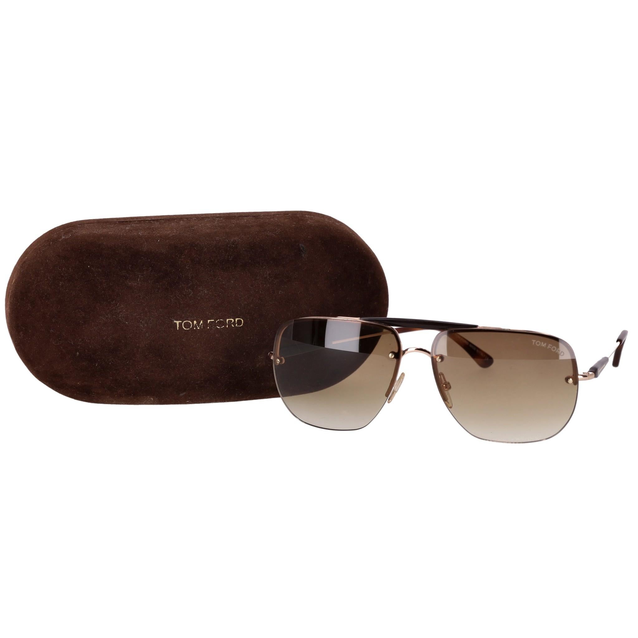Tom Ford Aviator Nils Sunglasses

Rectangular, rose gold framed sunglasses with gradient light brown lenses.

Detailed with 'Tom Ford' lettering to the lens and tortoiseshell temple tips.

Size – One Size

Condition – Good (Scratch to the