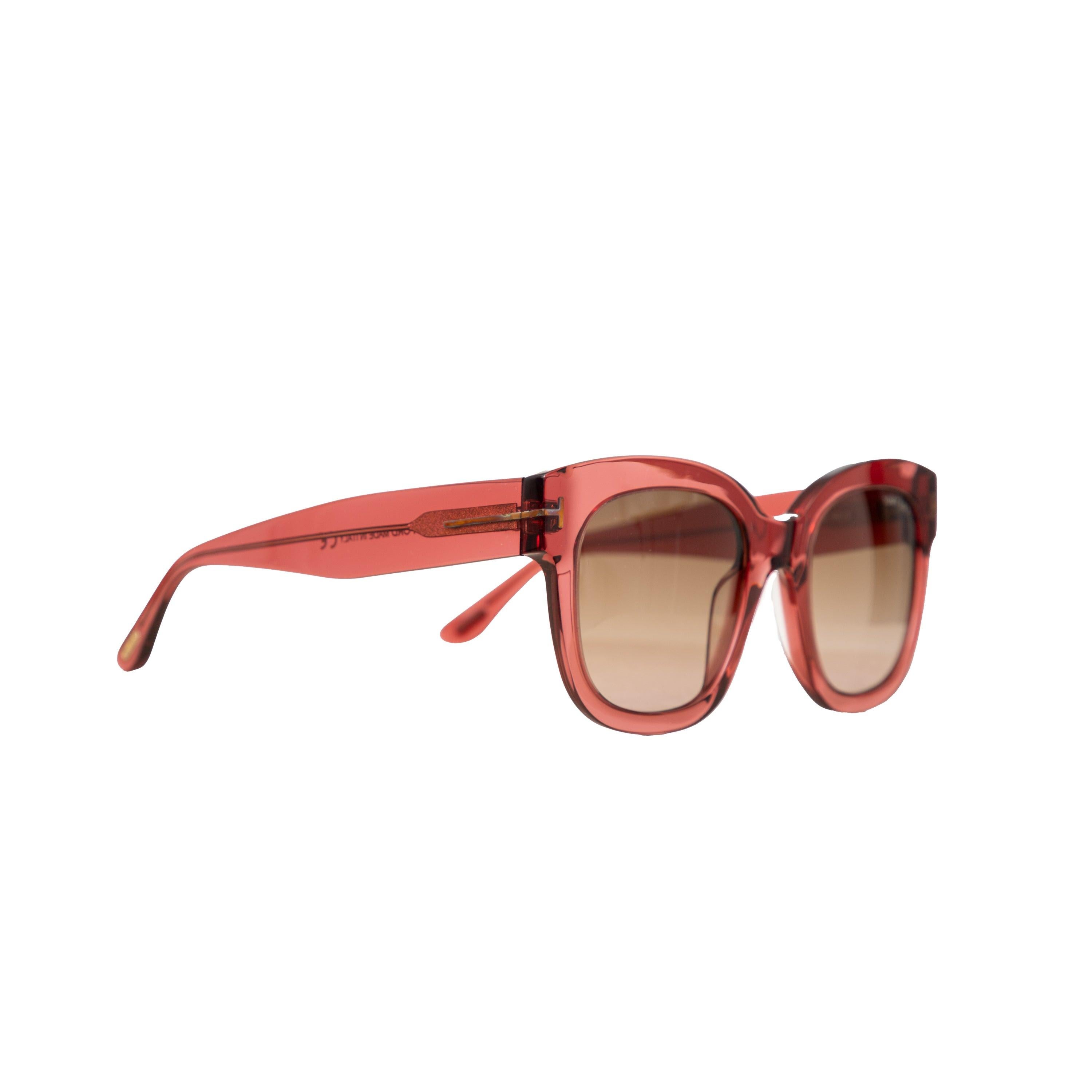 Expertly crafted by Tom Ford, the Beatrix 02 Sunglasses exude timeless chic and versatility. Adorned with the iconic metal T logo, these shades add a touch of sophistication to any look. The translucent plum frame is a must-have trendy hue this
