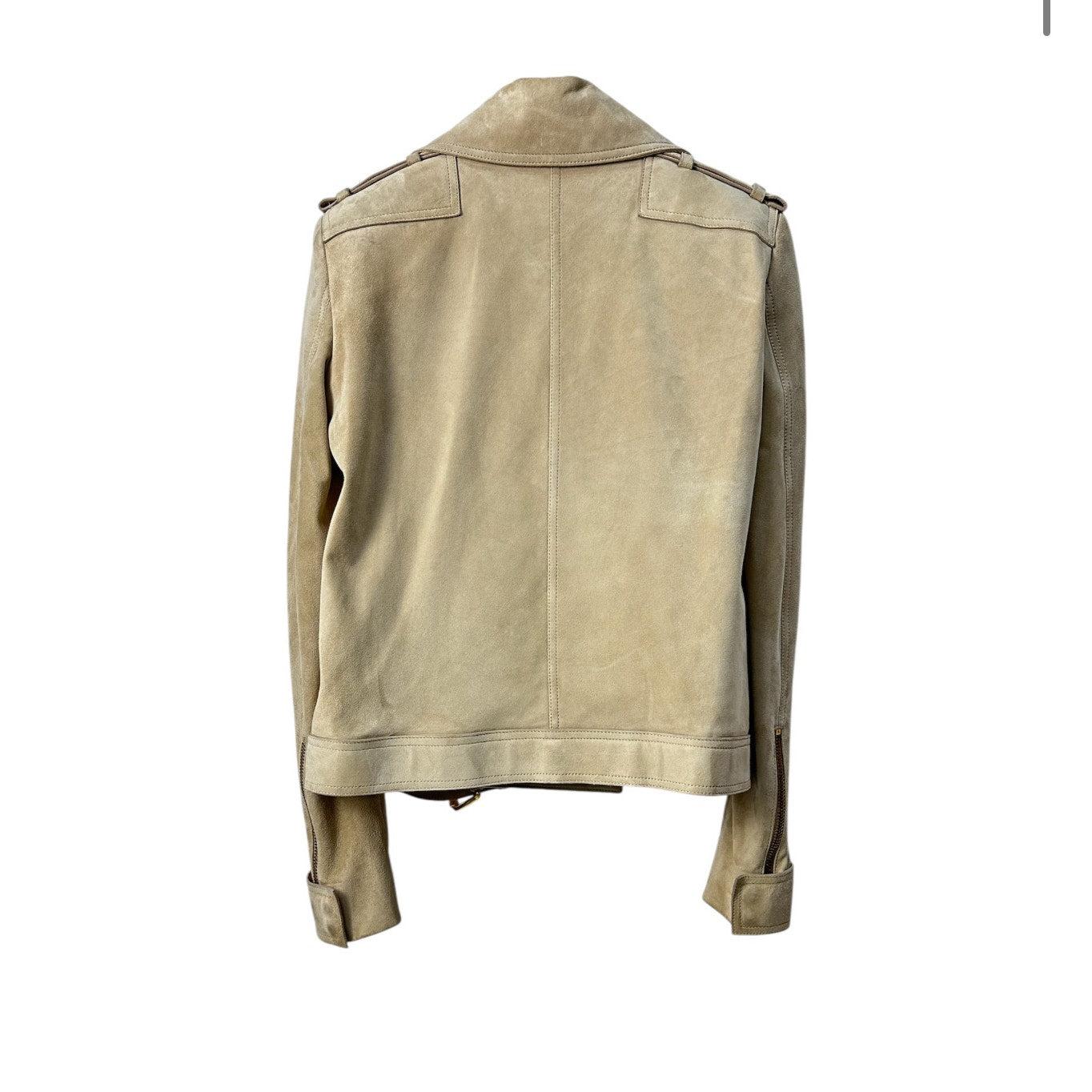 Stunning Tom Ford beige suede jacket in excellent condition! This stylish jacket features a chic slanted zip and elegant gold hardware. The strap at the bottom adds a touch of sophistication. 

Please review the pictures carefully for signs of wear.