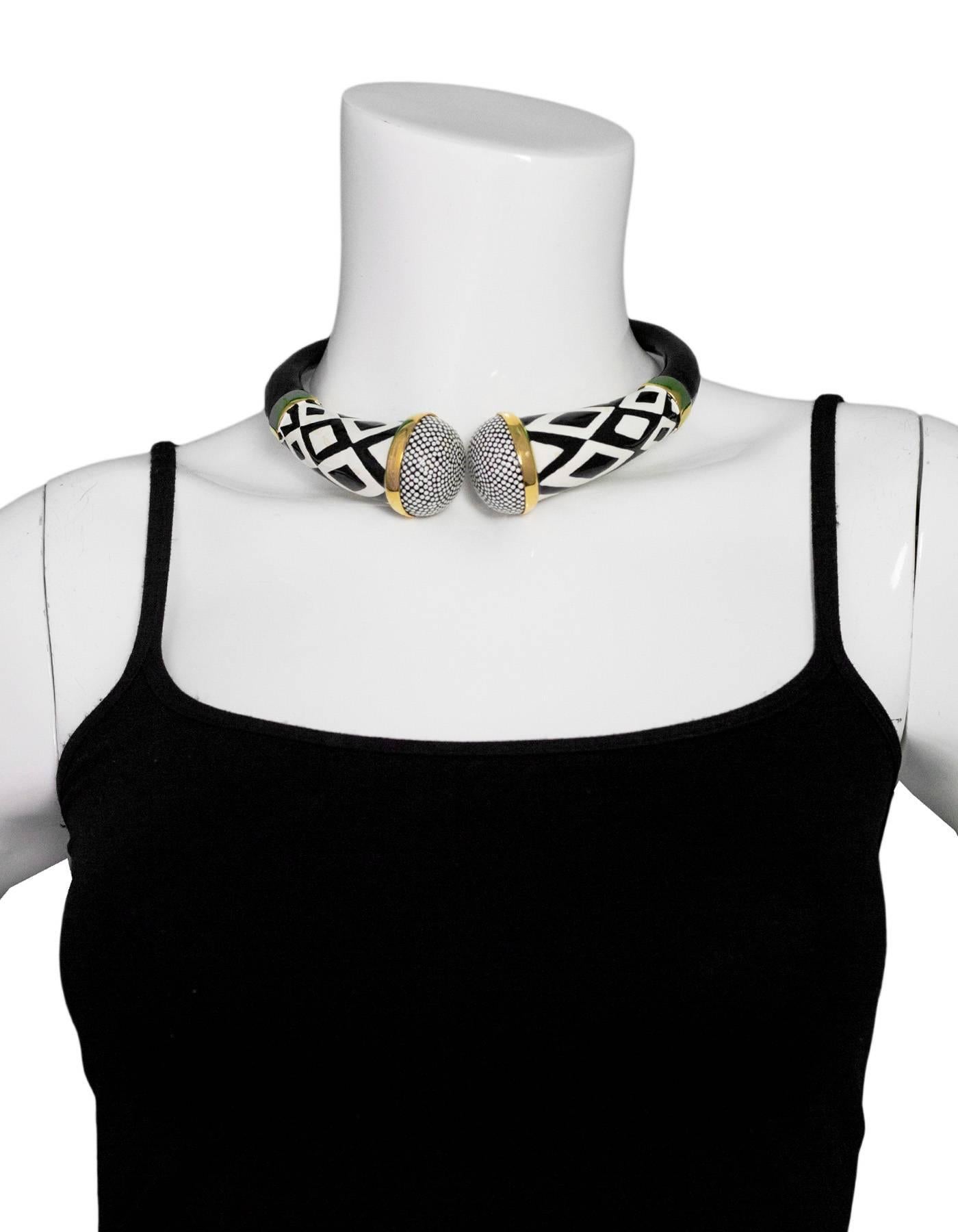Tom Ford Black & White Tribal Choker Necklace

Made In: Italy
Color: Black, white gold
Materials: Enamel, metal
Closure: Hinge closure
Stamp: Tom Ford Made in Italy
Overall Condition: Excellent pre-owned condition, with the exception of light