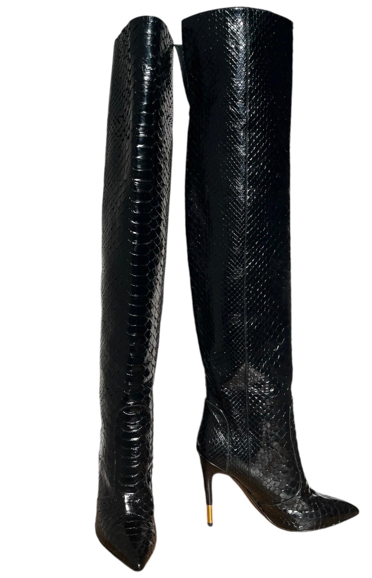 TOM FORD ANACONDA OVER THE KNEE BOOTS 
Looking to make a fierce fashion statement this season? Nothing says it more than the anaconda that forms this Tom Ford stiletto boot. Genuine anaconda (Argentina). Pointed toe. 4 1/4