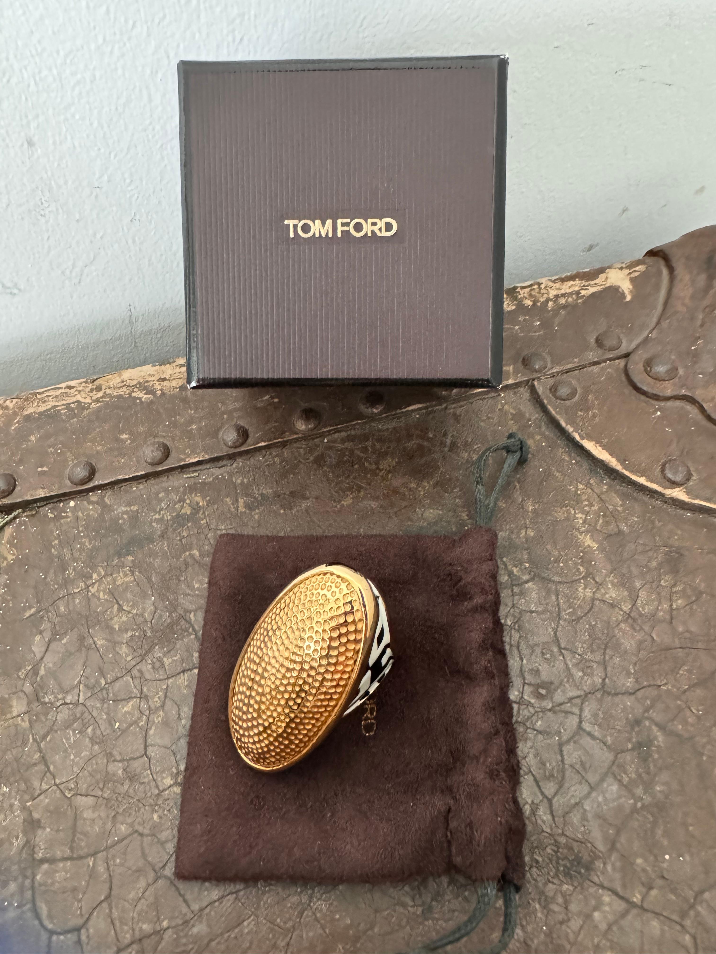 Elevate your jewelry collection with the striking elegance of the Tom Ford Black and White Enamel Cocktail Ring. This exquisite piece embodies the luxurious sophistication and bold design aesthetic for which Tom Ford is renowned, making it a