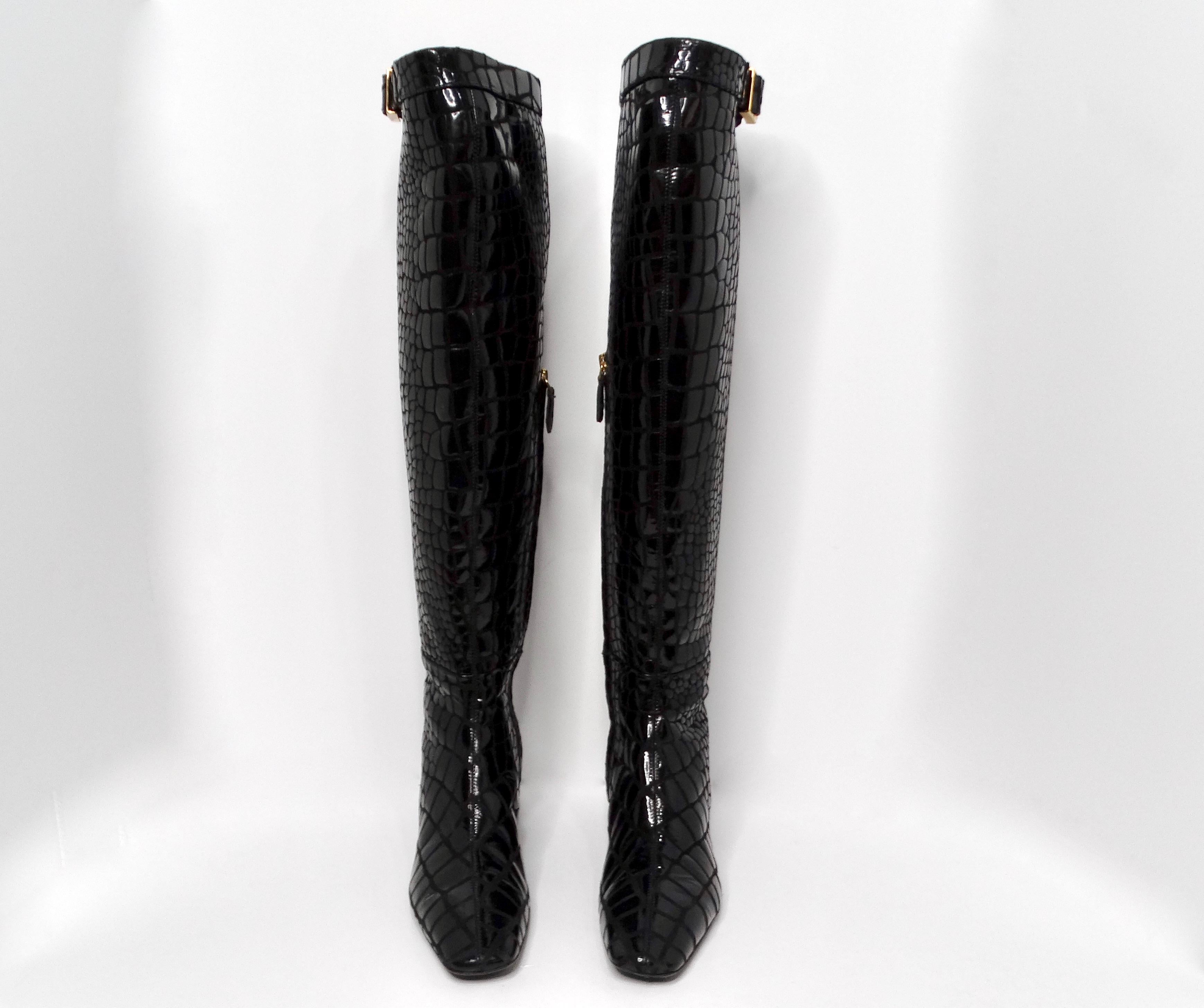 Step into elegance with the Tom Ford Black Crocodile Embossed Leather Knee-High Boots, an exquisite blend of luxury and style. Crafted from Italian leather, these knee-high boots feature a sophisticated crocodile embossing that adds texture and