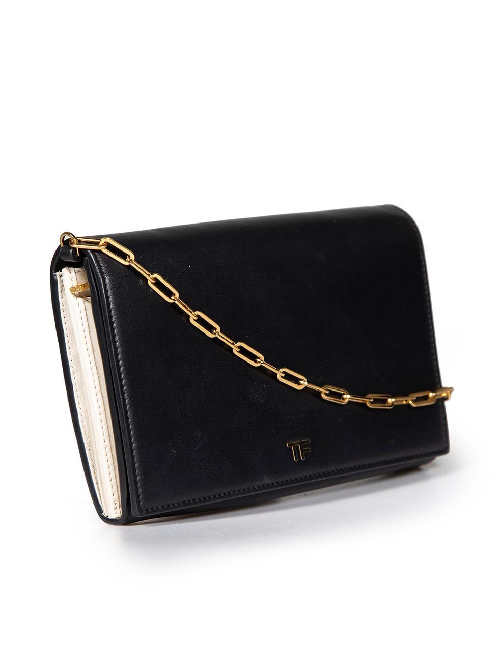 CONDITION is Very good. Minimal wear to clutch is evident. Minimal discoloured marks to overall leather. Discoloured zip mark and red stains on interior on this used Tom Ford designer resale item.
 
 
 
 Details
 
 
 Black
 
 Leather
 
 Chained