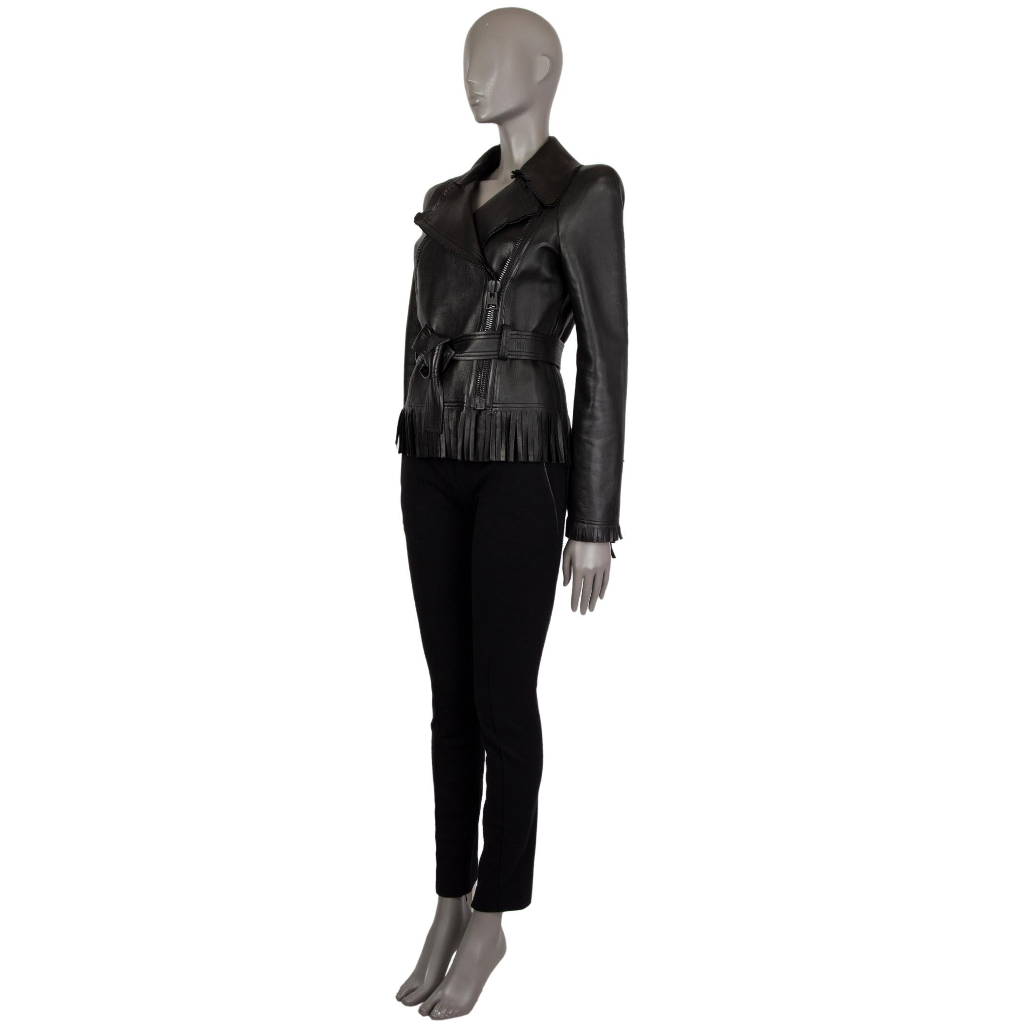 Tom Ford biker jacket in black leather. With short and medium-length wide fringe trims, storm flap on the back, one diagonal zipper pocket on the chest, and belt loops around the waist. Closes with wide zipper on the front in black metal. Lined in