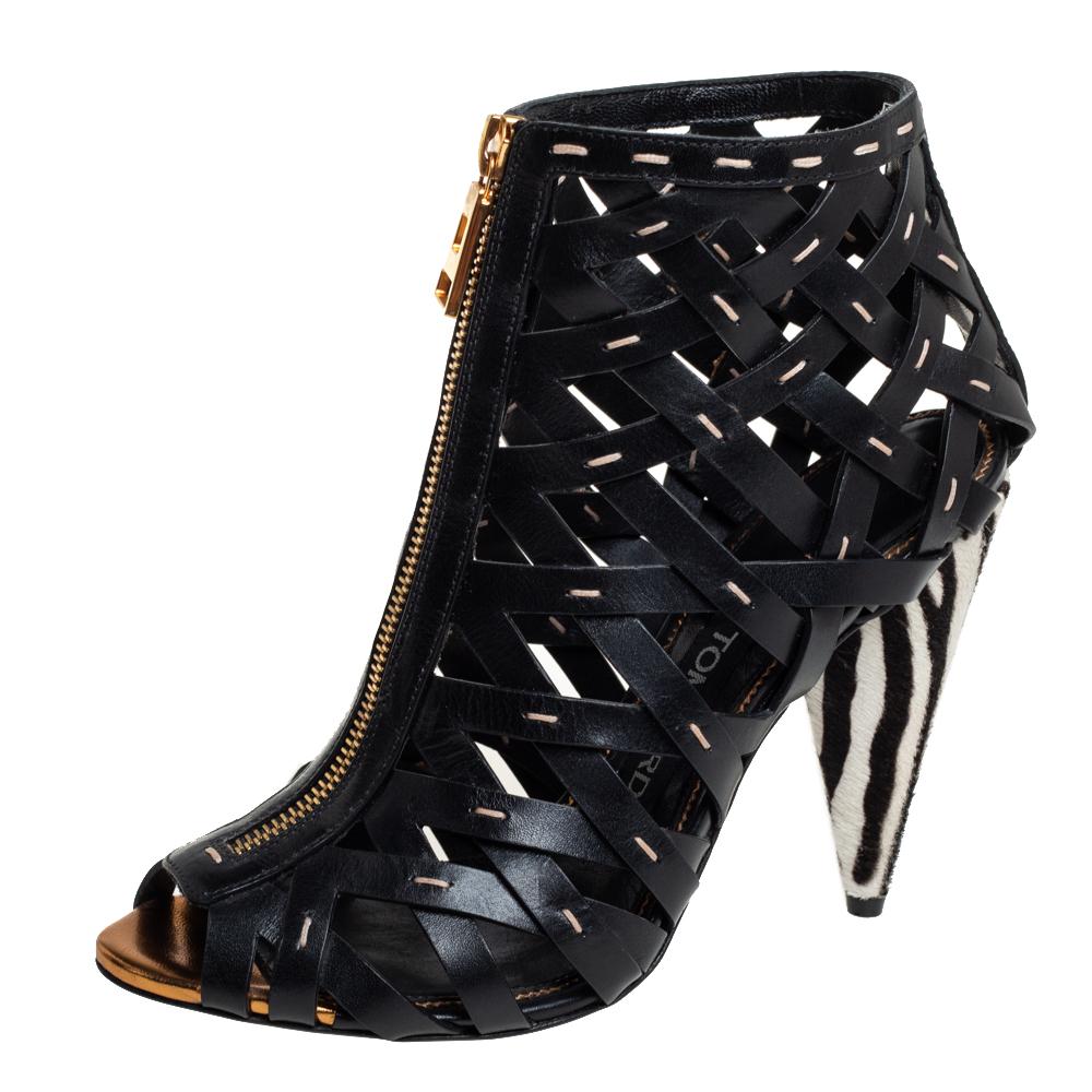 These stunning ankle booties from Tom Ford project a contemporary style! To deliver a see-through effect, the booties are woven from leather straps in a cage-style design and secured with front zippers. They are set atop 11 cm heels that are covered
