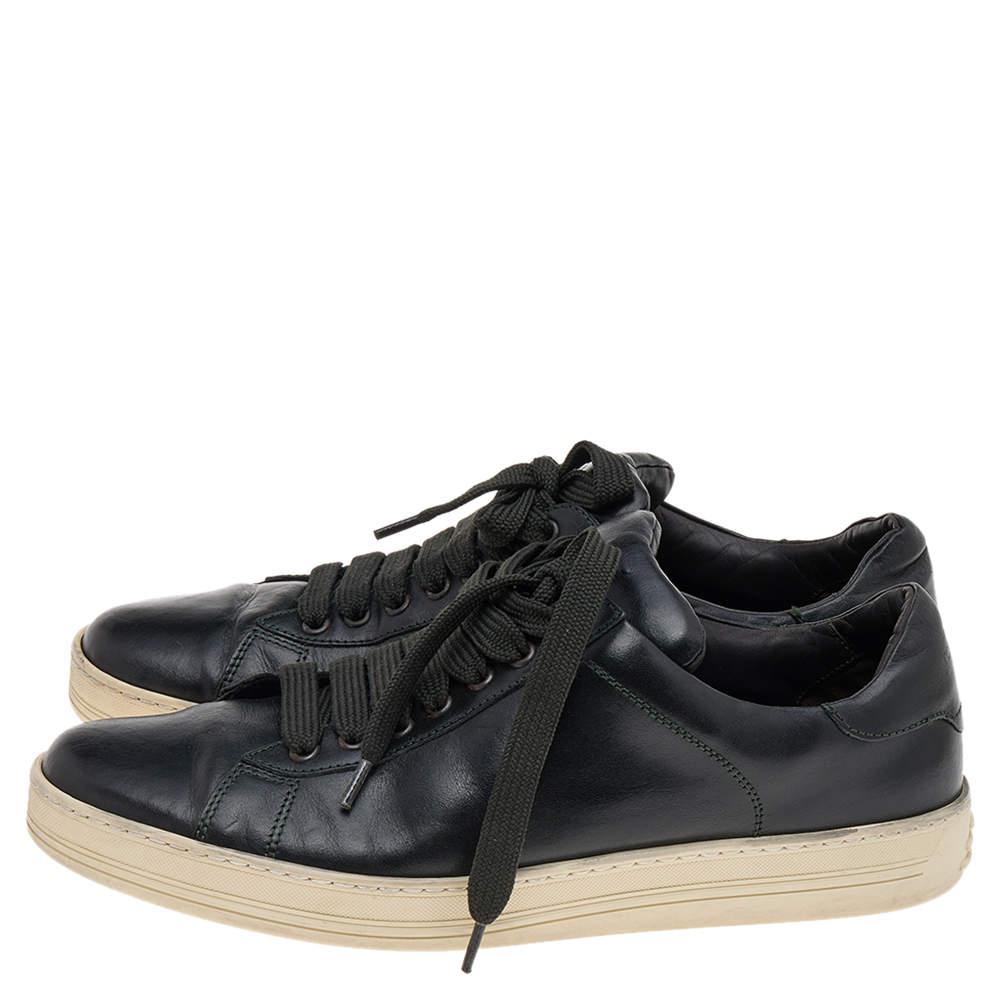 Coming in a classic low-top silhouette, these Tom Ford sneakers are a seamless combination of luxury, comfort, and style. They are made from leather in a black shade. These sneakers are designed with logo details, laced-up vamps, and comfortable
