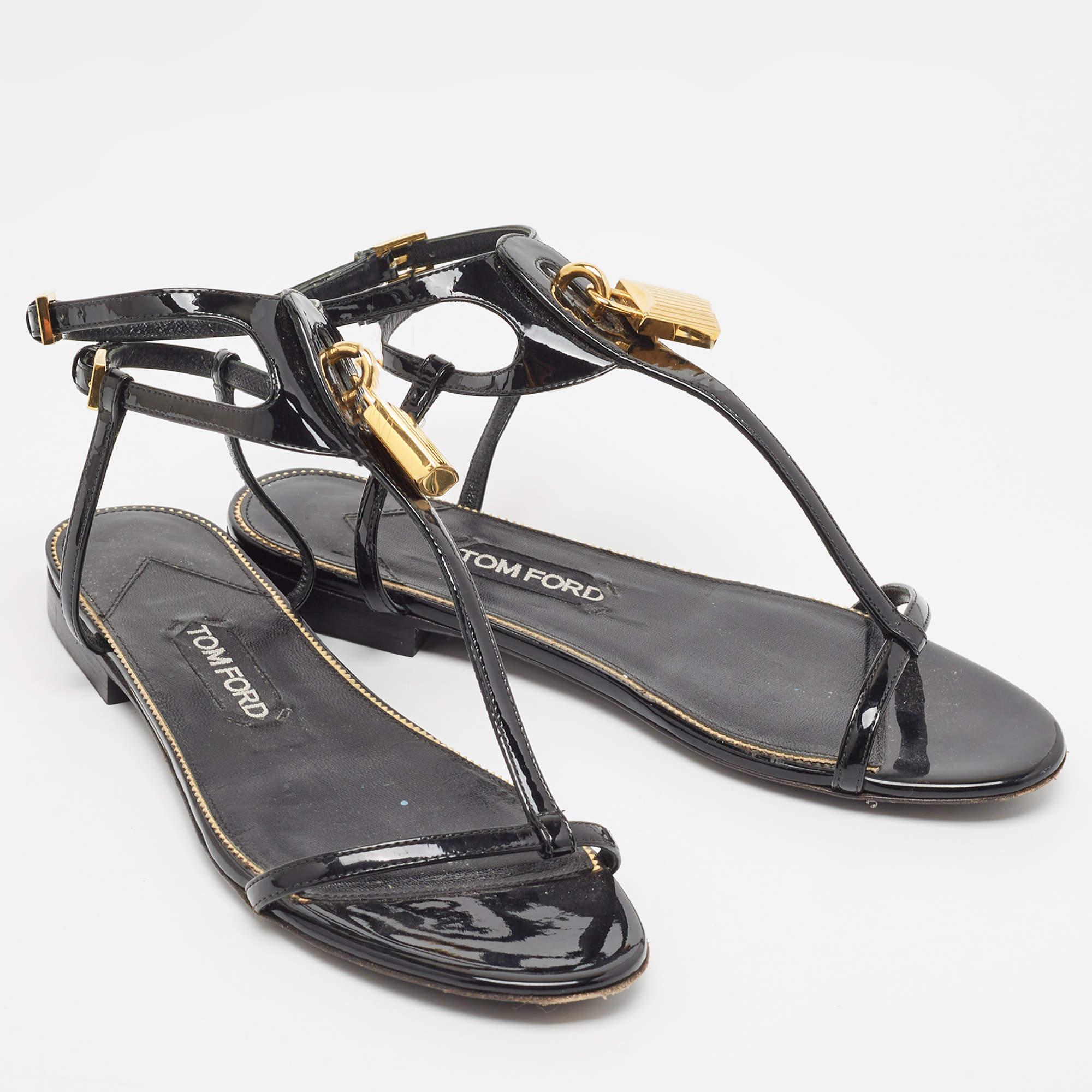 Simplicity is really glorious and these flats from Tom Ford are a testament to that belief. Beautifully crafted from patent leather, the flats flaunt open toes, padlock details and buckle ankle straps. Team these with a pretty sundress to make an