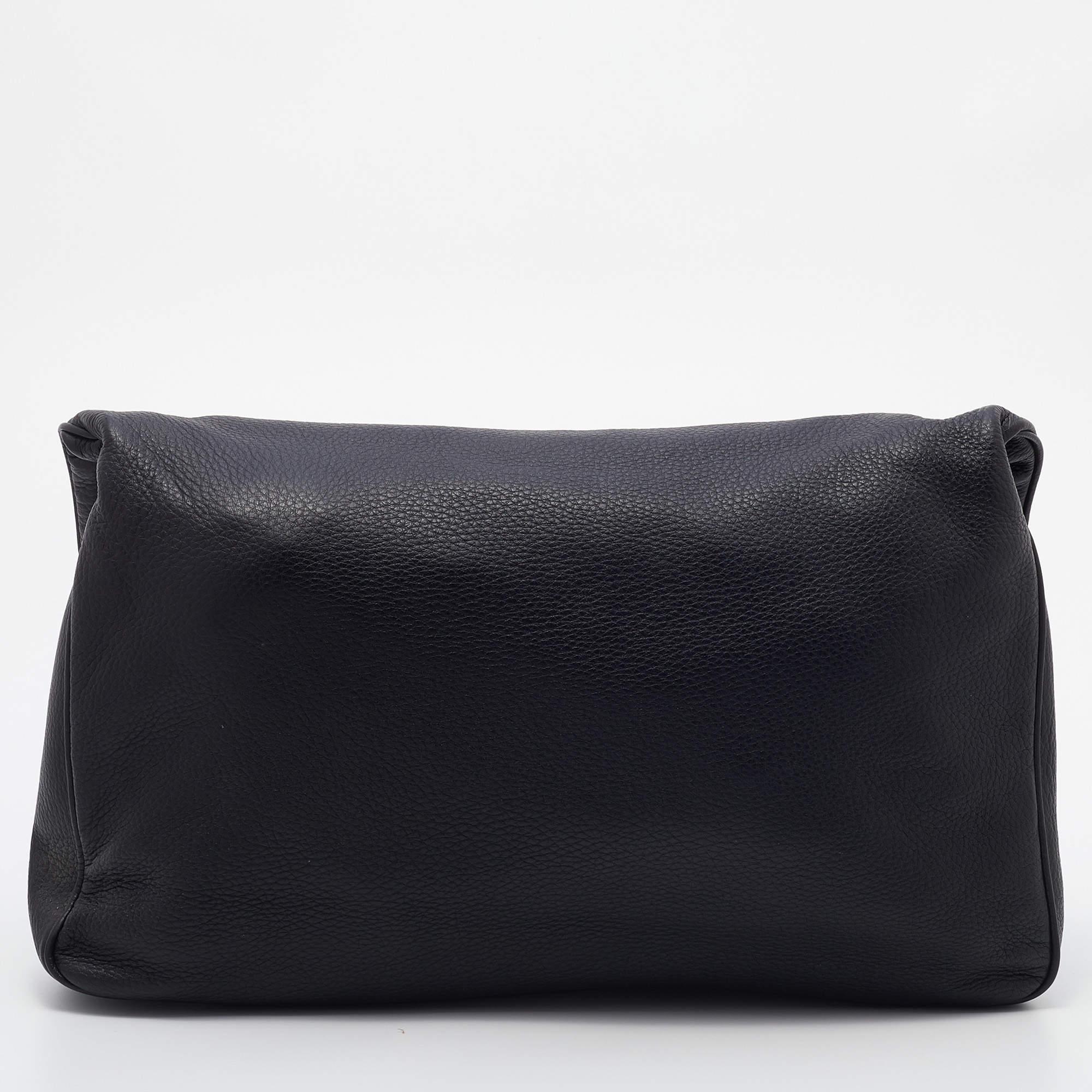 Functional and fashionable, this clutch is a classy styling choice. It is crafted from quality materials, and its lined interior will keep your evening essentials in a neat way.

