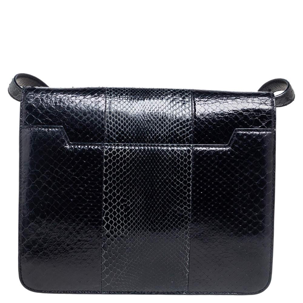 This Natalia bag is a loved design by Tom Ford. This here is crafted from python leather and designed with a flap that has a large turn lock carrying the signature TF engravings. The Alcantara interior is well sized and the bag is complete with a