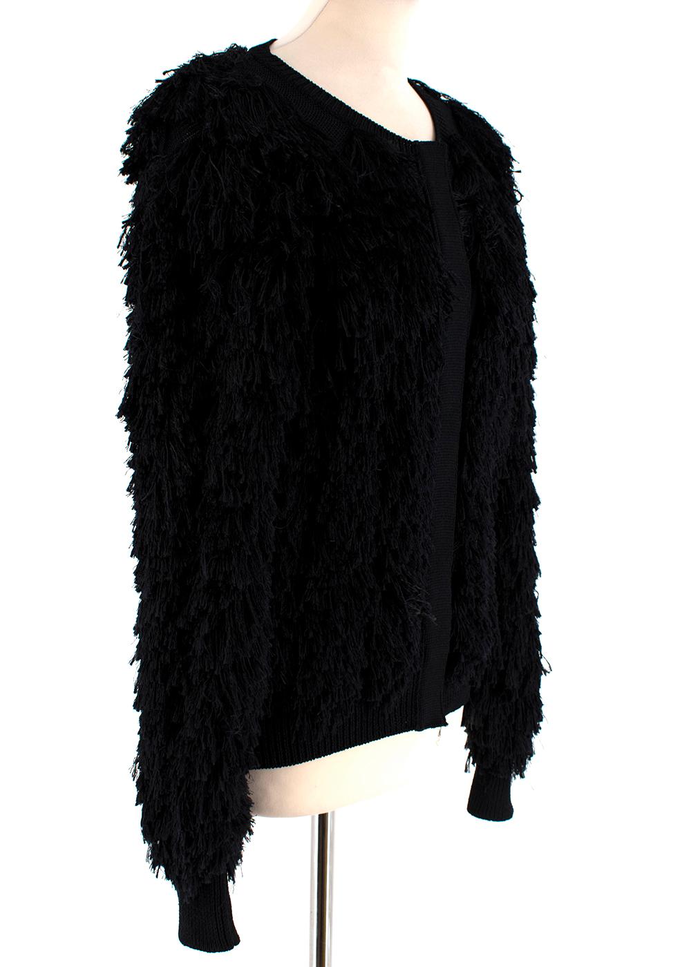 Tom Ford Black SIlk Blend Fringed Cardigan

-Black fringe cardigan
-Hidden button detail
-Materials : 68% Silk 24% Viscose 8% Polyester
-Made in Italy

Measurements are taken with the item lying flat, seam to seam.
Length - 61cm
Shoulder -