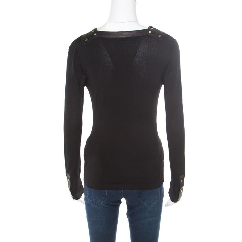 Tom Ford offers designs with a modern twist for fashionable souls. This top, made from blended fabric, is a perfect example of classic style and elegance. It comes in black with a cowl neckline, studded trims and long sleeves.

Includes: The Luxury