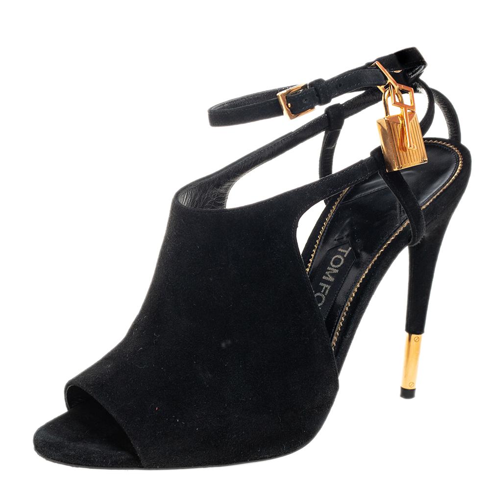 Created with contemporary design aesthetics, these stunning Tom Ford sandals are sure to be a worthy investment! They come finely crafted from black suede and feature an open-toe silhouette. They flaunt ankle straps with a gold-tone padlock