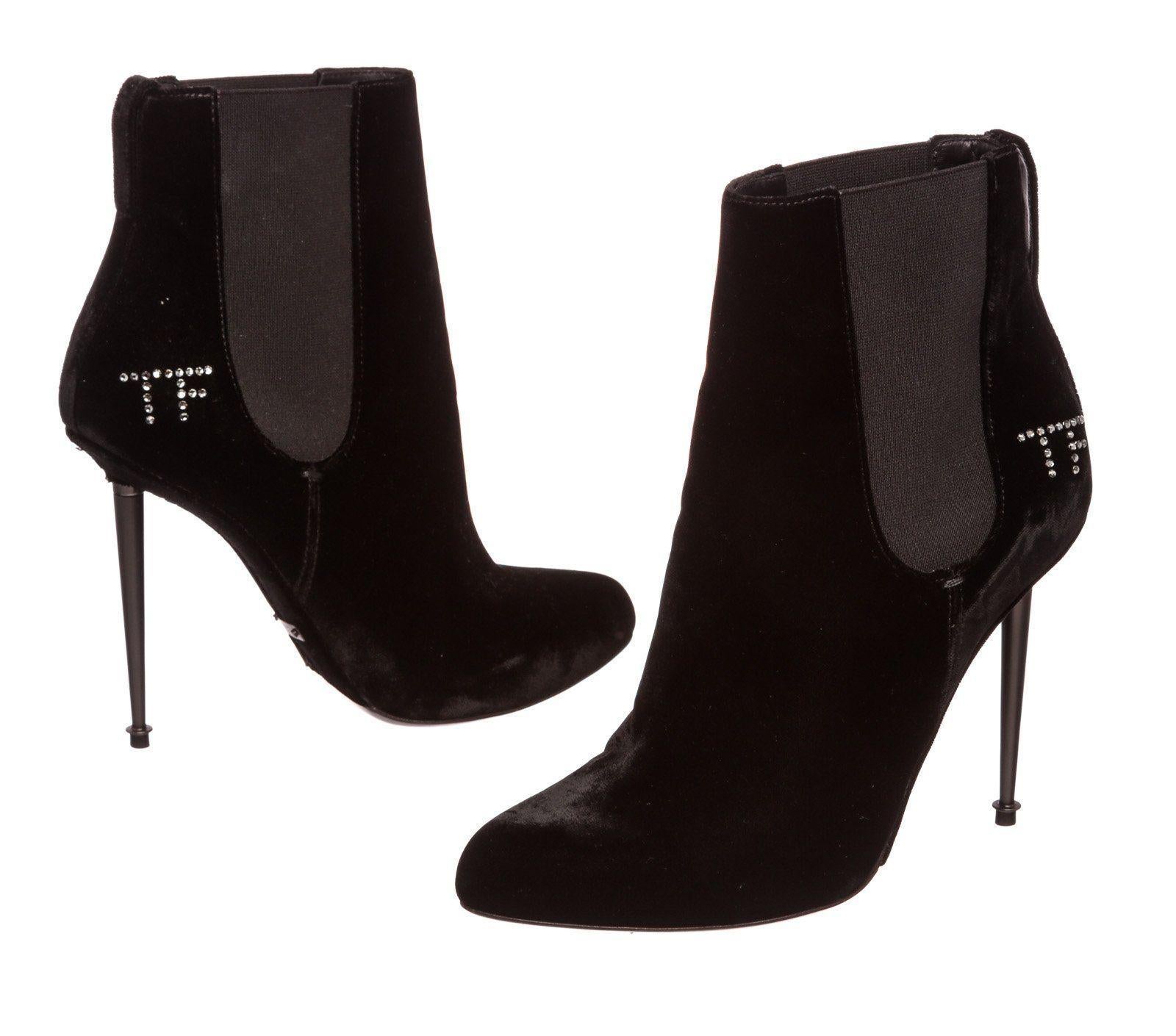 Black velvet Tom Ford Spiked boots with crystal TF logo embellishment.

23110MSC


Measurements:
	Length: 10.5 in / 27 cm
	Width: 4.5 in / 11 cm
CONDITION: Pre-Owned
Good overall, please see photographs for detail.