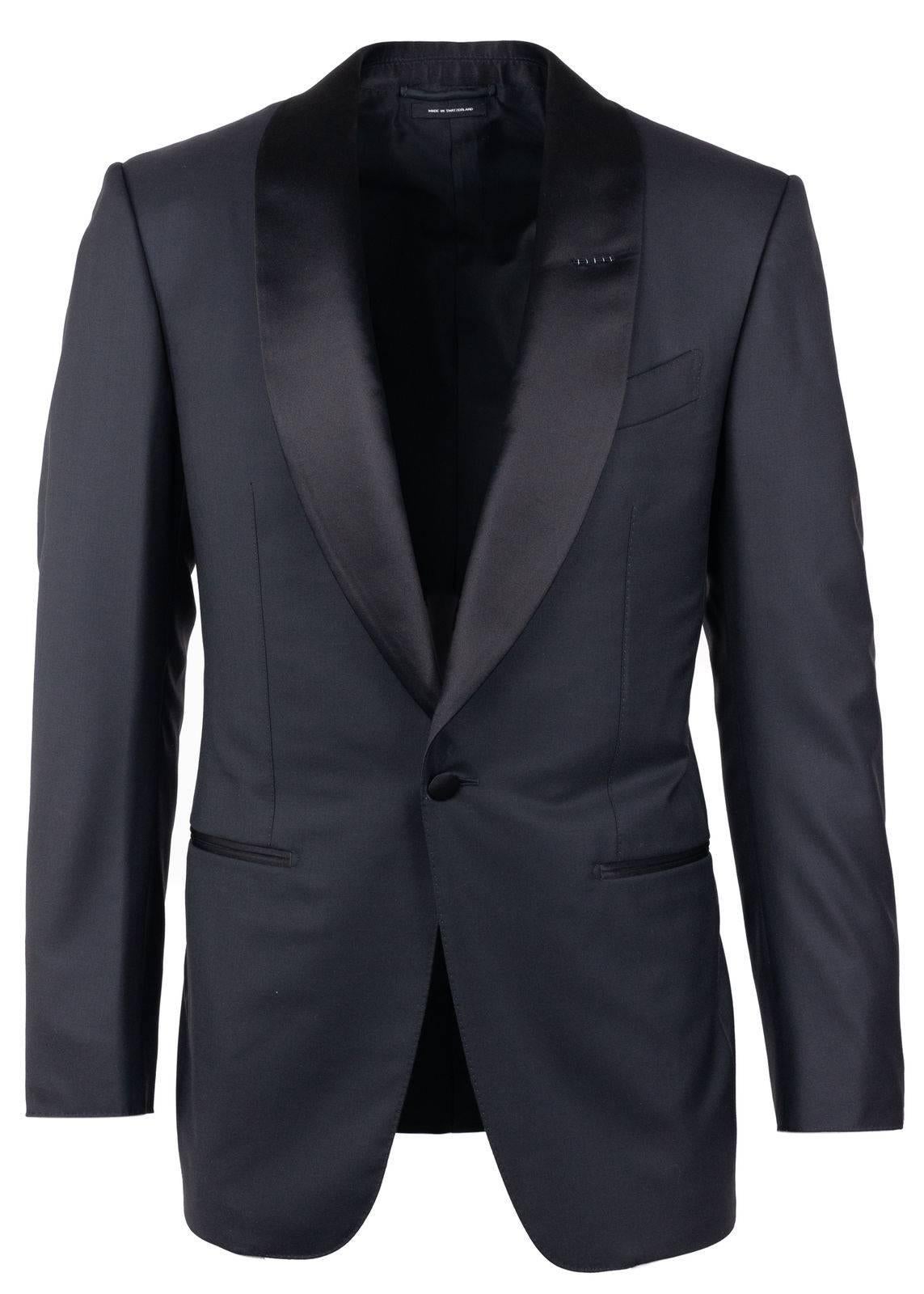 Start the night as the exemplary attendee in your Tom Ford Tuxedo suit. This smooth Windsor two piece features a satin shawl lapel, baste stitching, and single button cuff. You can pair this suit with a pristine white button down for refined