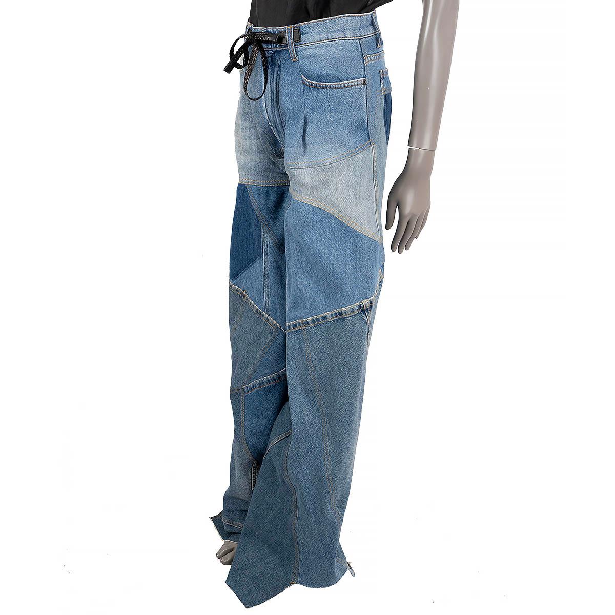 100% authentic Tom Ford high rise jeans in blue patchwork cotton denim (100%). Features wide legs, distressed edges, two leather patches at the waistband, three pockets at the front and one at the back. Have been worn and are in excellent