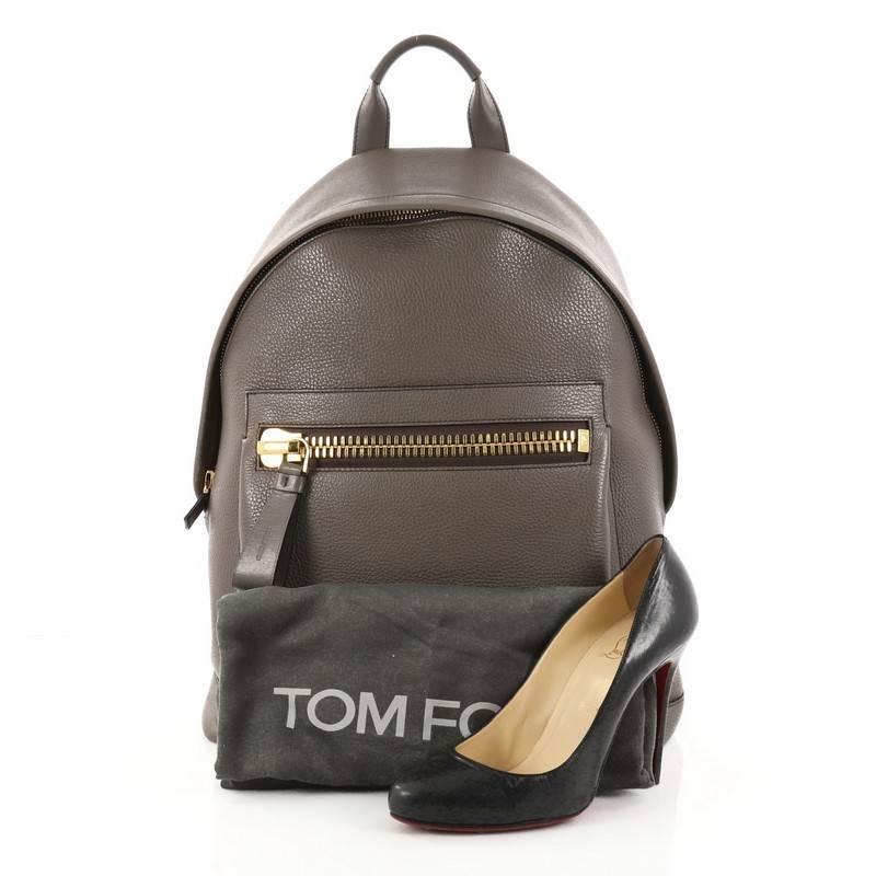 This authentic Tom Ford Buckley Backpack Leather is an iconic bag perfect for on-the-go moments. Crafted in taupe leather, this backpack features top handle, adjustable shoulder straps, front zip pocket with signature heavy-metal zipper and