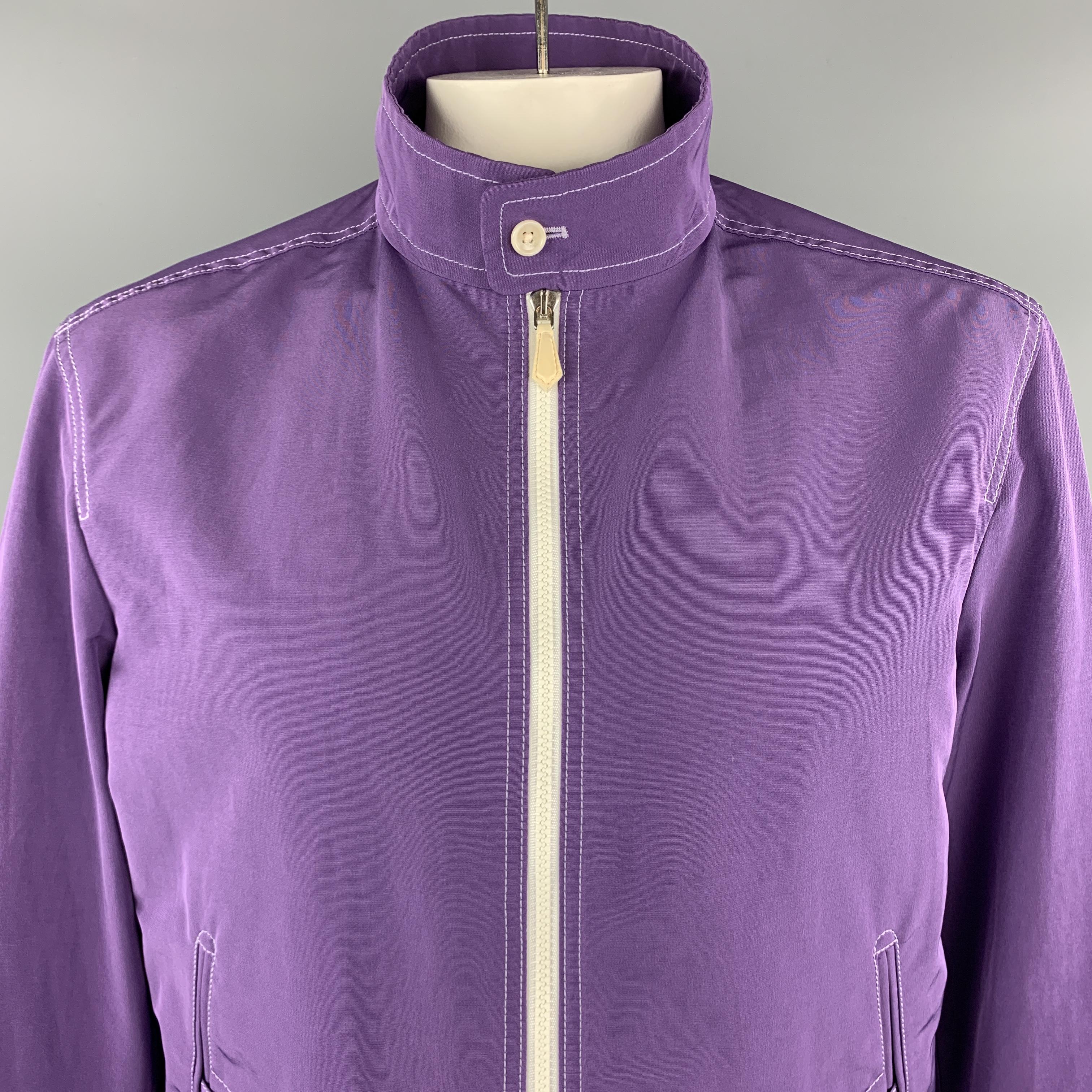 TOM FORD Jacket comes in a purple tone in a cotton blend material, with a high collar, contrast stitch and zip, buttoned pockets, ribbed cuffs, zip up. Made in Italy.

Excellent Pre-Owned Condition.
Marked: IT 52

Measurements:

Shoulder: 18.5 in.