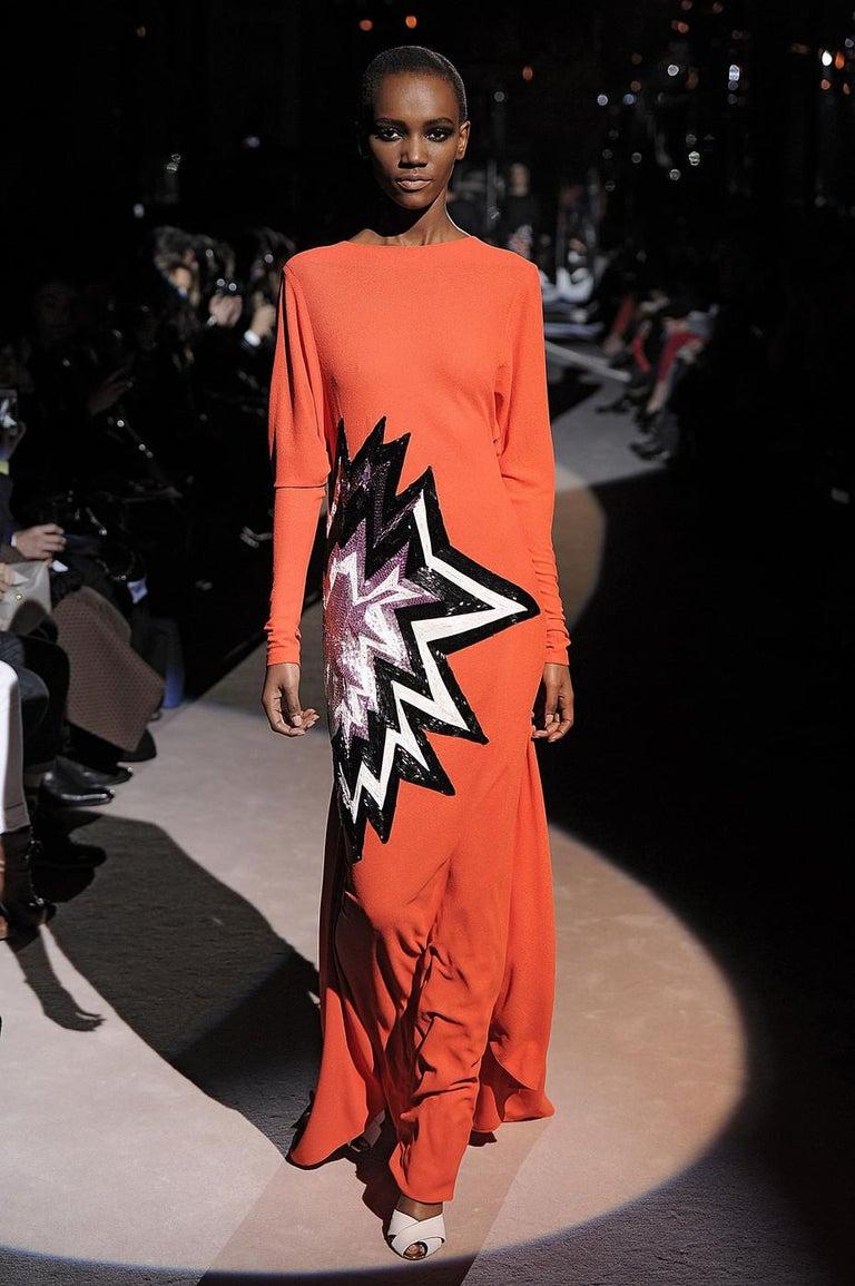 Tom Ford; coral viscose crepe evening dress with train and Pop Art inspired beading

Fall-Winter 2013