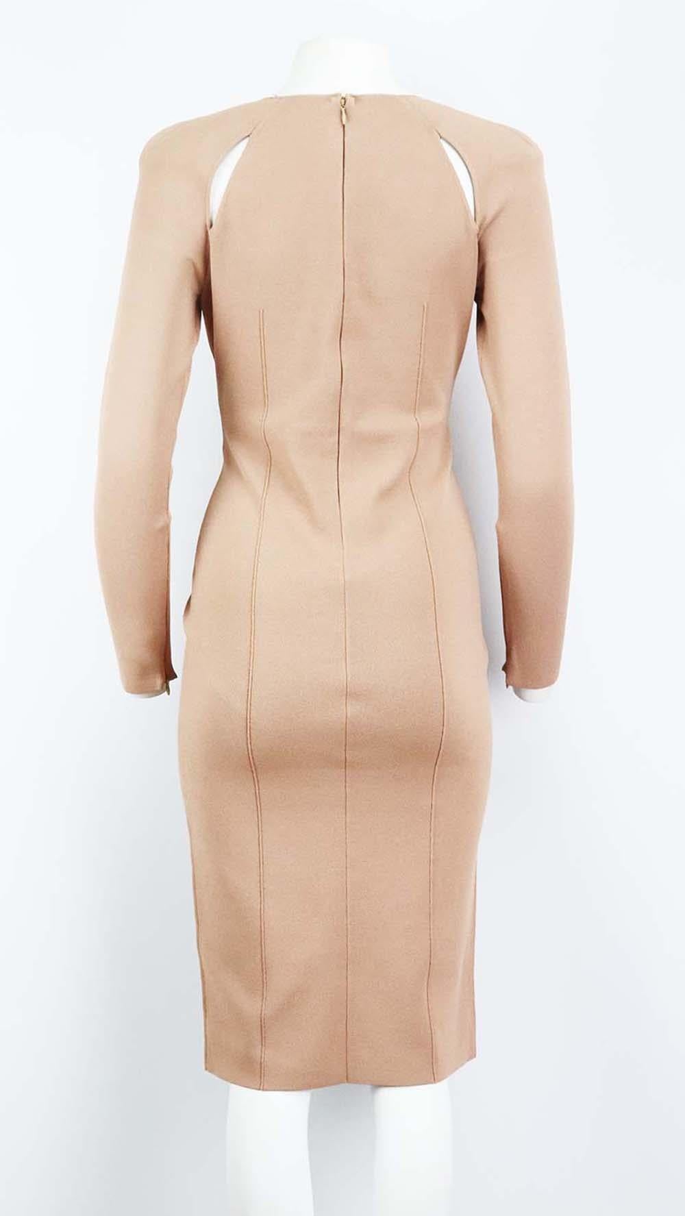 This dress by Tom Ford has been impeccably tailored which accentuates your figure, it's cut from smooth stretch-knit and has a striking cutout detail to show off the padded strong shoulders. Pink stretch-knit. Zip fastening at back. 83% Viscose, 17%