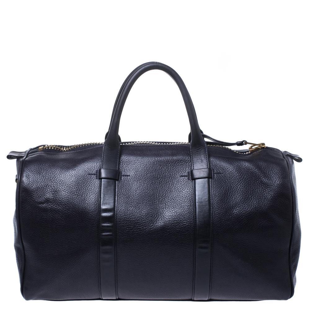 Carry this Tom Ford Buckley duffle bag for an instantly stylish yet laid back look. Its smart design is made from dark plum-colored leather, completed with smooth leather trims on the front, back, and double top handles. Its top zip closure features