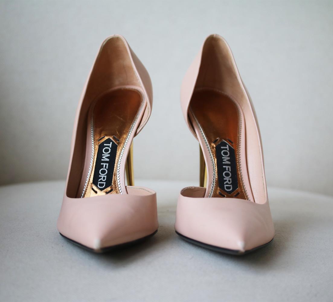 TOM FORD's Italian-made leather pumps have a flattering d'Orsay-style cutout and sleek pointed toe. The versatile nude shade is complemented perfectly by the brand's signature gold heel. Gold heel measures approximately 101 mm/ 4 inches. Nude-pink