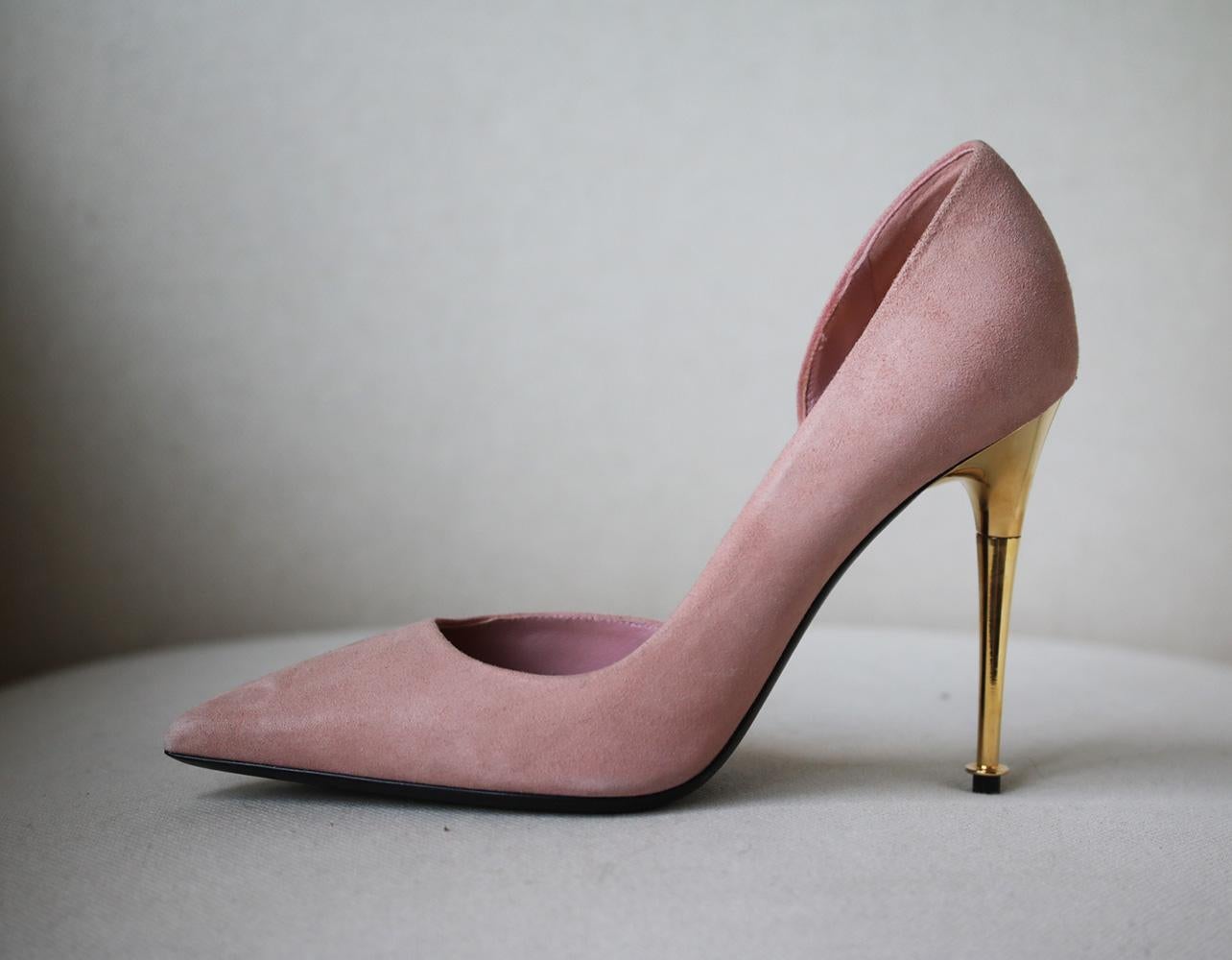 TOM FORD's Italian-made suede pumps have a flattering d'Orsay-style cutout and sleek pointed toe. The versatile nude shade is complemented perfectly by the brand's signature gold heel. Gold heel measures approximately 101 mm/ 4 inches. Nude-pink