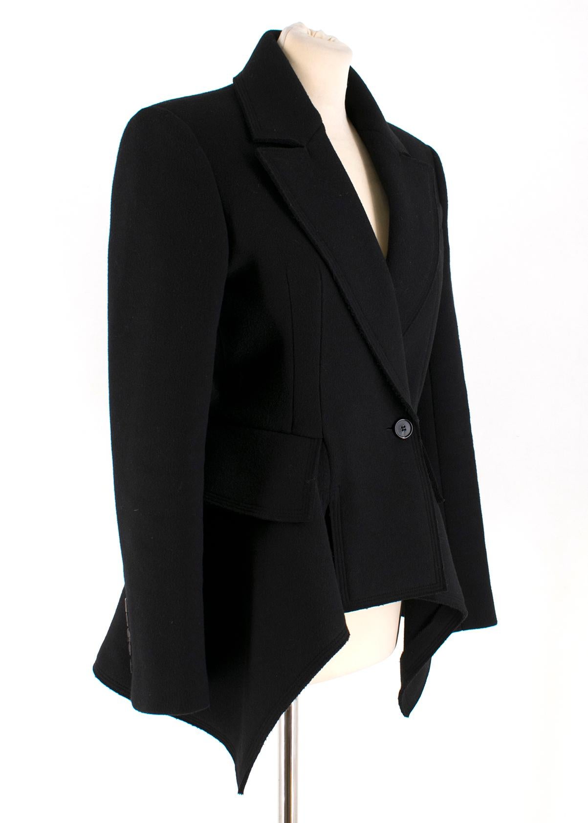 Tom Ford Double Breasted Cashmere Blend Peplum Coat 

- Black wool and cashmere blend 
- 100% silk lining 
- Defining padded shoulders
- Small left breast pocket 
- Button fastening at front 
- Waist defining peplum hem 
- Enlarged flap pockets on