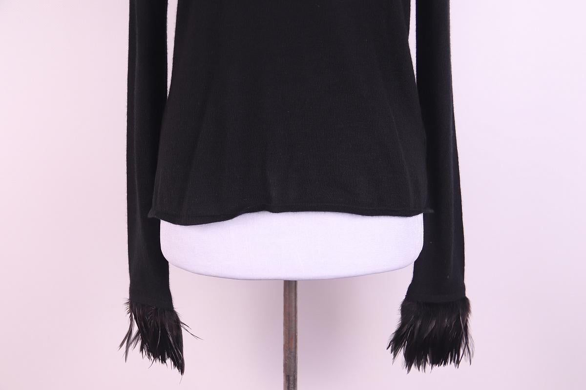 Tom Ford Era Gucci Cashmere & Feather Sweater
2000s
This is the perfect little black sweater that you will reach for over and over. It is made from a thin, light cashmere that feels luxurious and decadent when on. The sleeves are amazing - each is