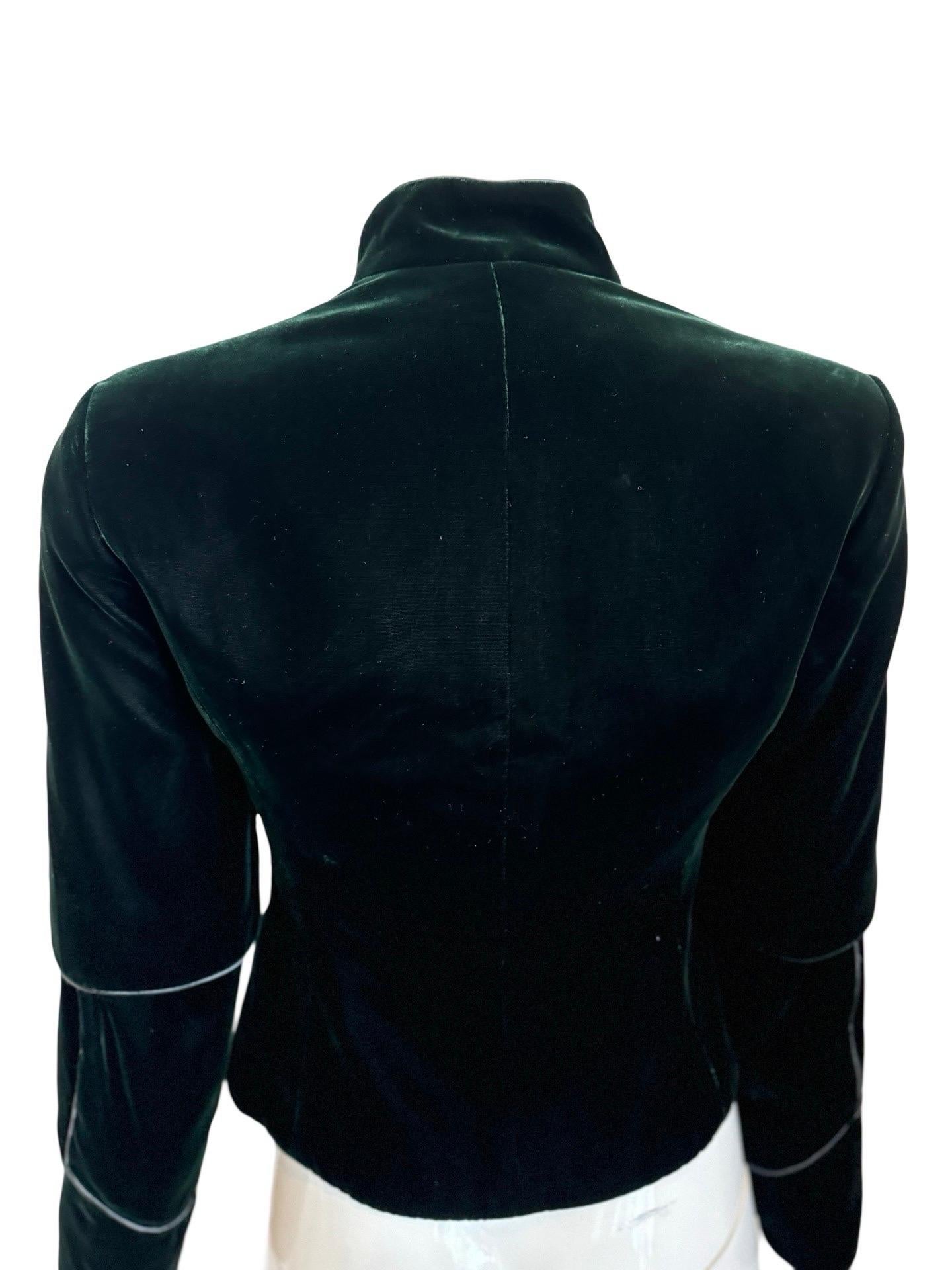 Early Y2K Tom Ford for Yves Saint Laurent collection.  This is a stunning velvet jacket in a deep dark green with a square angled neckline.  The piping detailing is done with a wrapped silk thread which is absolutely gorgeous.  The buttons are a