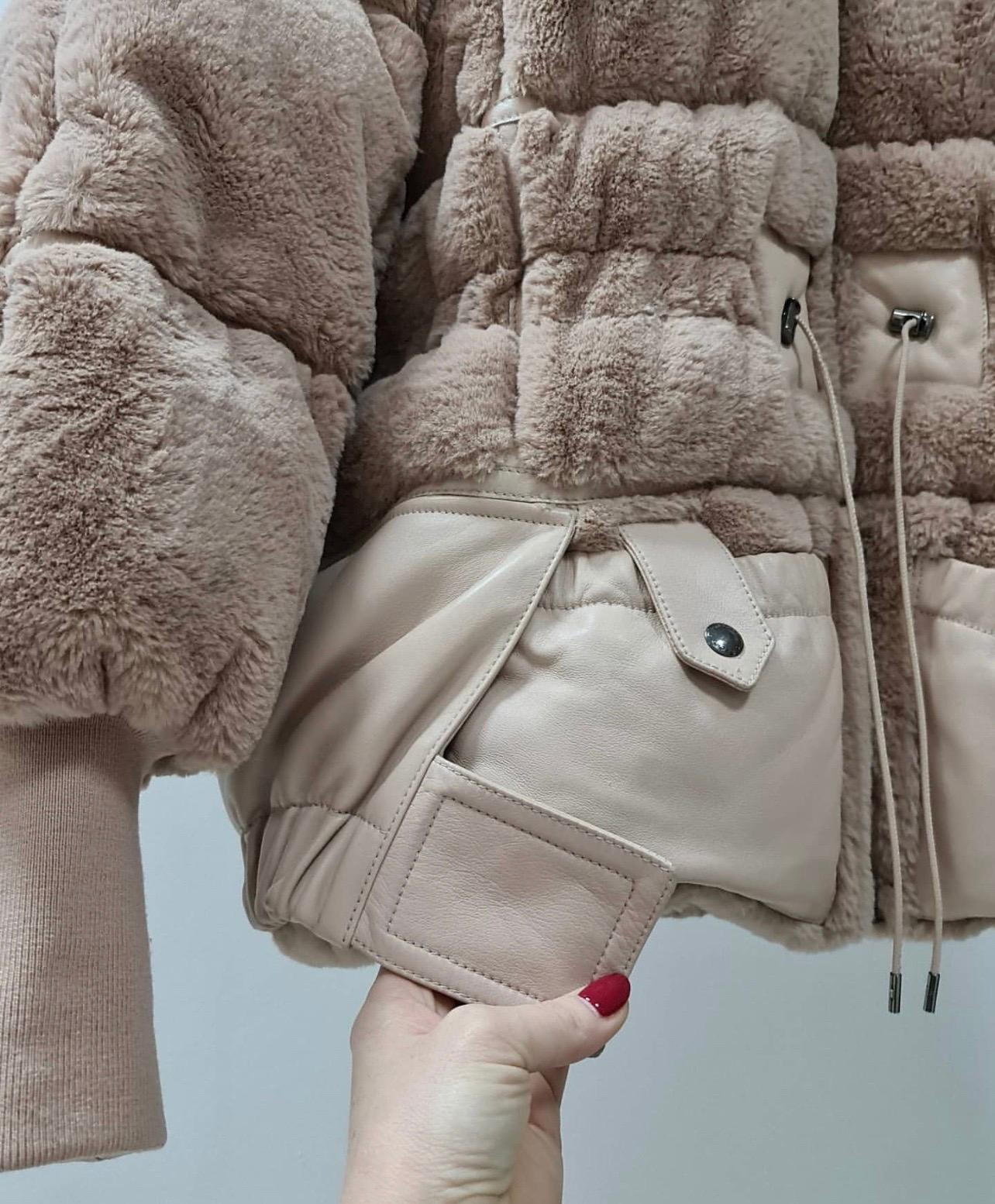 Pink feather down-lamb fur blend faux beaver padded bomber-jacket from Tom Ford featuring a hood with drawstring tie fastenings, a high standing collar, a front zip fastening, rounded shoulders, long sleeves, ribbed cuffs, a padded interior, a full