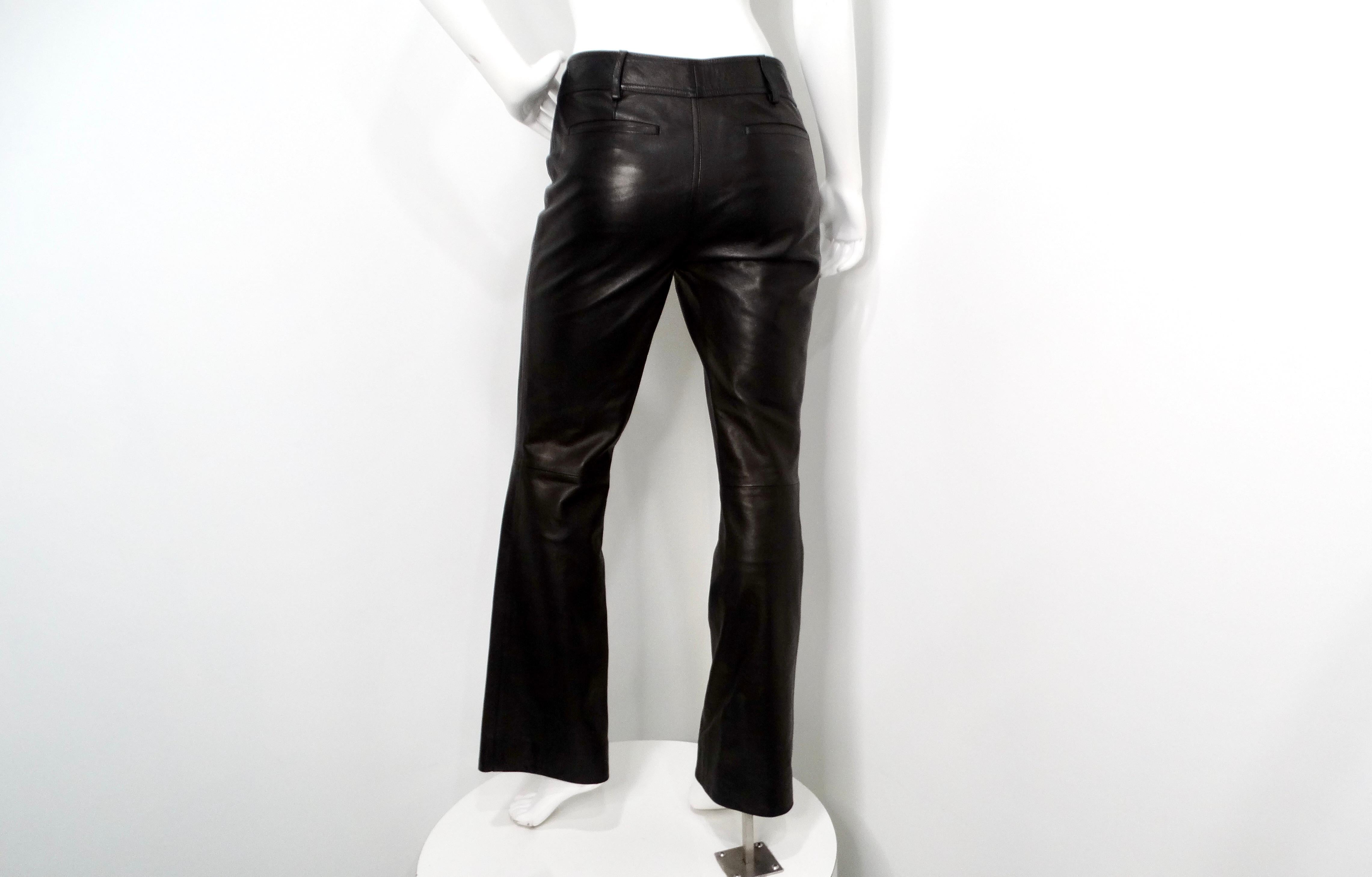 Step into the glamour of the 1990s with these iconic Tom Ford for Gucci Black Lambskin Leather Flare Pants, a quintessential piece that epitomizes luxury and bold design. Crafted from sumptuous lambskin leather, these pants feature a flattering