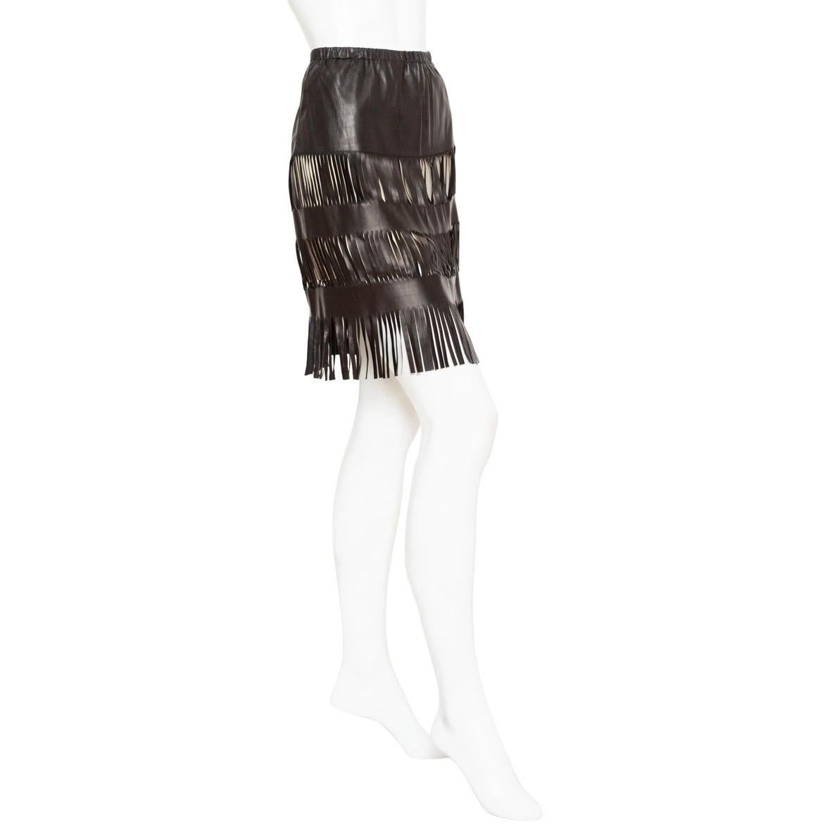 Gucci 1999 Black Lambskin Fringed Skirt

Spring 1999 Ready-to-Wear Collection by Tom Ford
Black/Beige
Above the knee
Cutout accents throughout
Fringed hem
Leather covered elasticized hem
Pull on
100% leather; 100% silk lining
Made in Italy
Good